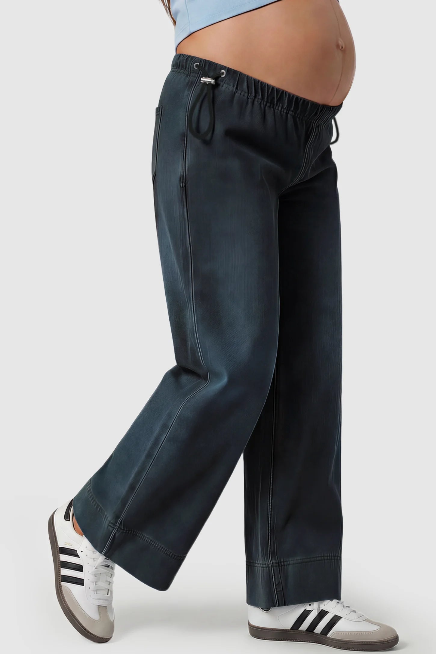 Drawstring Wide-Leg Maternity Jeans Drawstring Wide-Leg Maternity Jeans in black featuring adjustable waist and relaxed full-length silhouette on pregnant model side view.