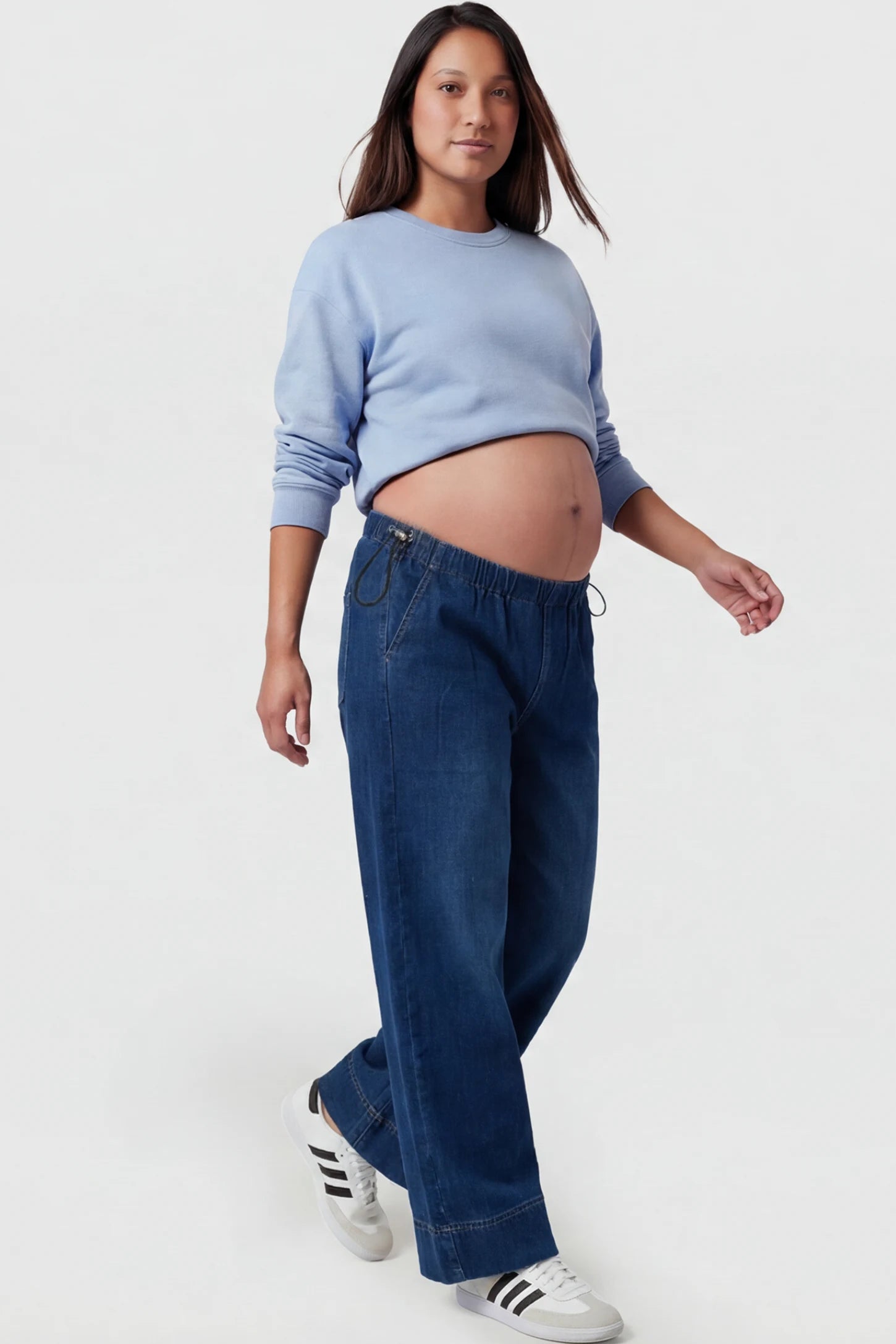 Drawstring Wide-Leg Maternity Jeans Drawstring Wide-Leg Maternity Jeans in dark blue featuring adjustable waist and relaxed full-length silhouette on pregnant model showing front.