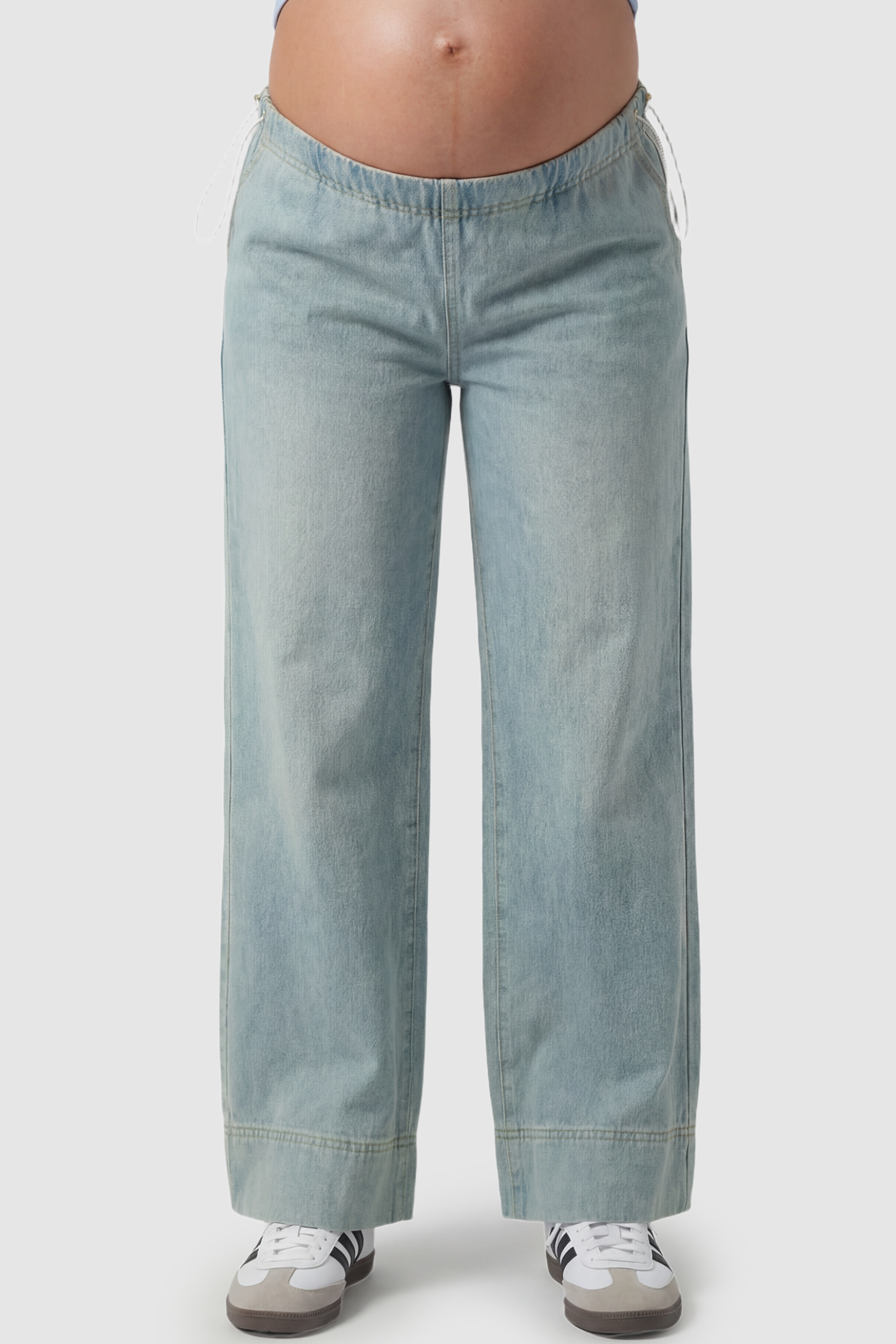 Drawstring Wide-Leg Maternity Jeans Drawstring Wide-Leg Maternity Jeans in light blue featuring adjustable waist and relaxed full-length silhouette on pregnant model front view.