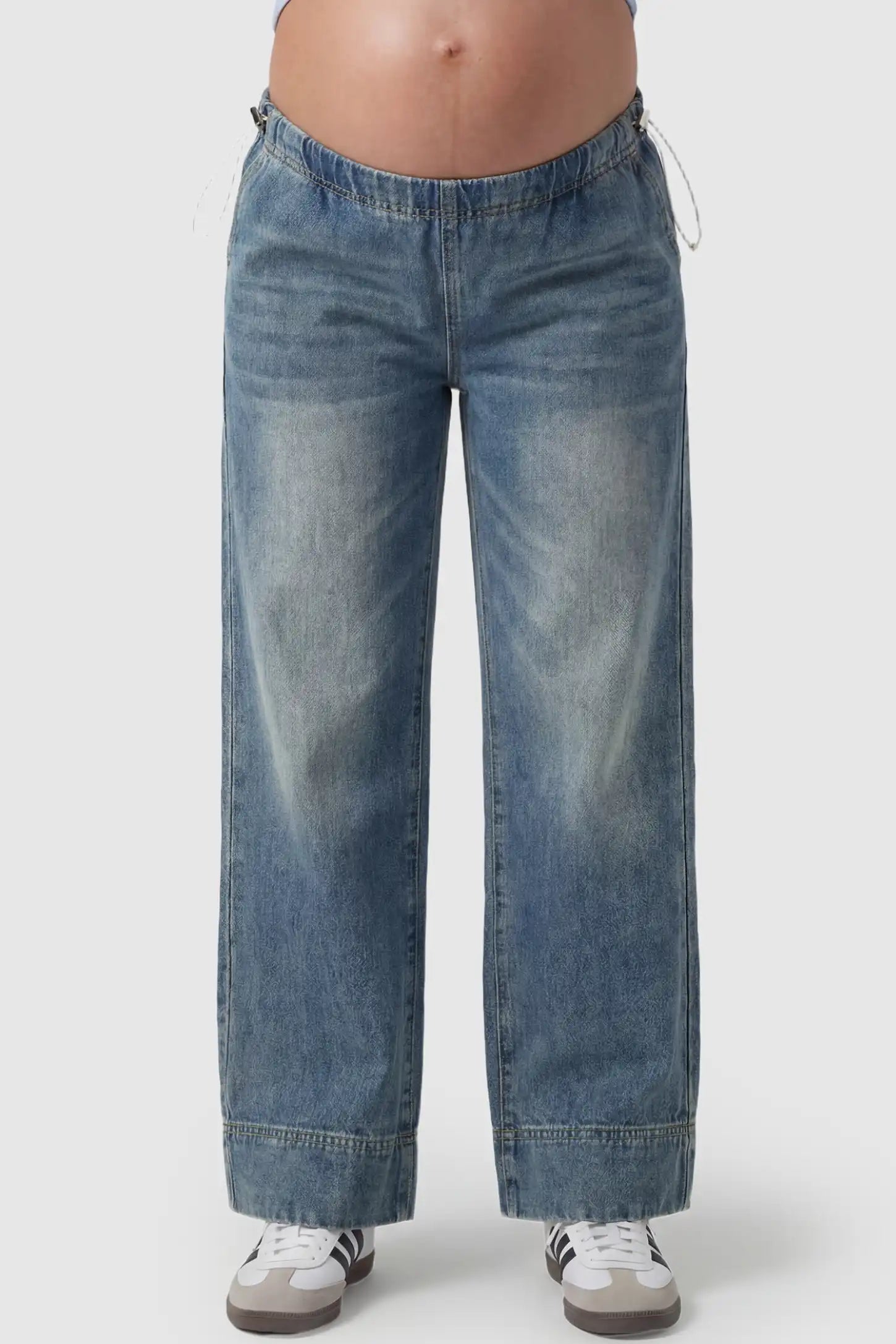 Drawstring Wide-Leg Maternity Jeans Drawstring Wide-Leg Maternity Jeans in vintage blue featuring adjustable waist and relaxed full-length silhouette on pregnant model front view.