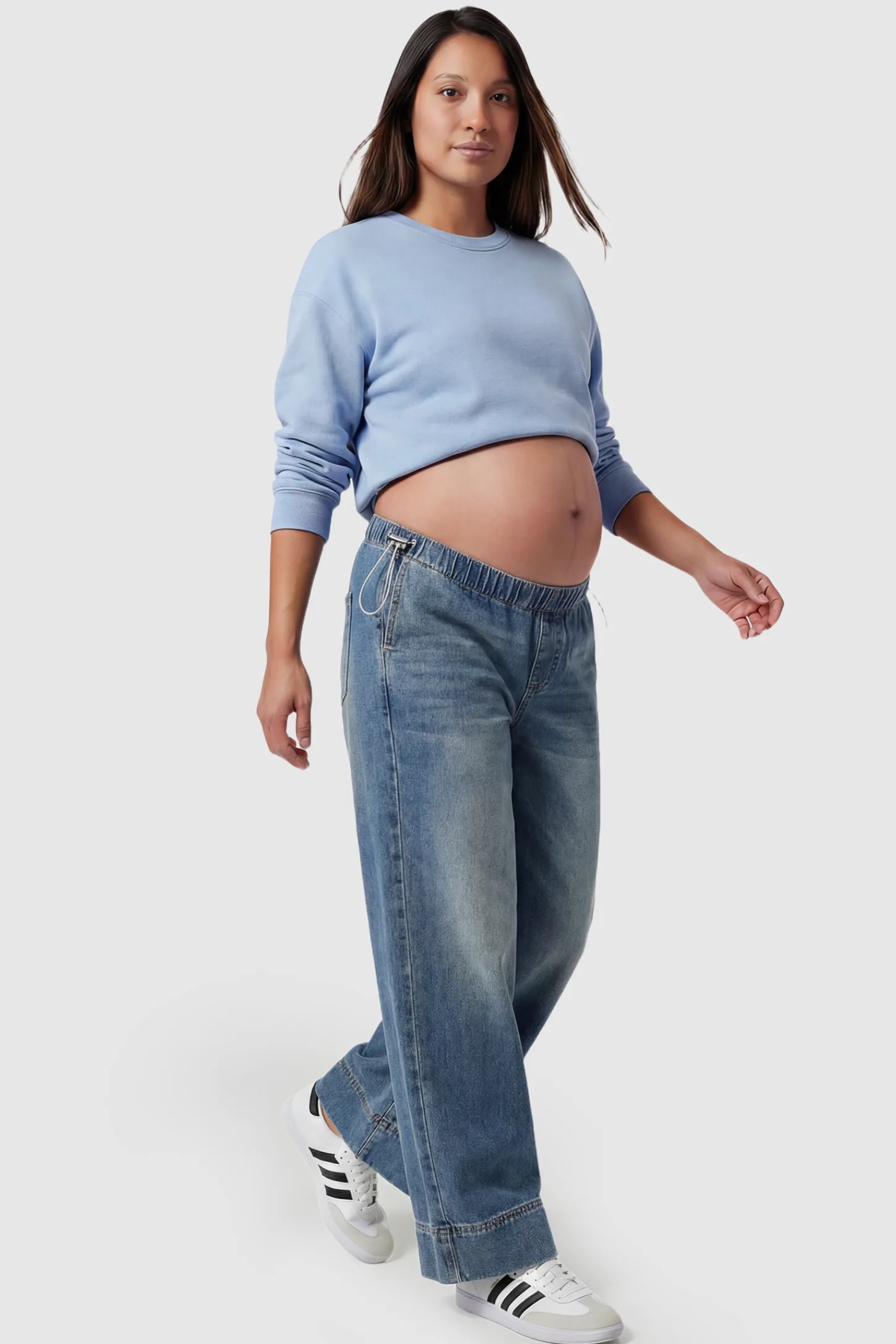 Drawstring Wide-Leg Maternity Jeans Drawstring Wide-Leg Maternity Jeans in vintage blue featuring adjustable waist and relaxed full-length silhouette on pregnant model showing front.