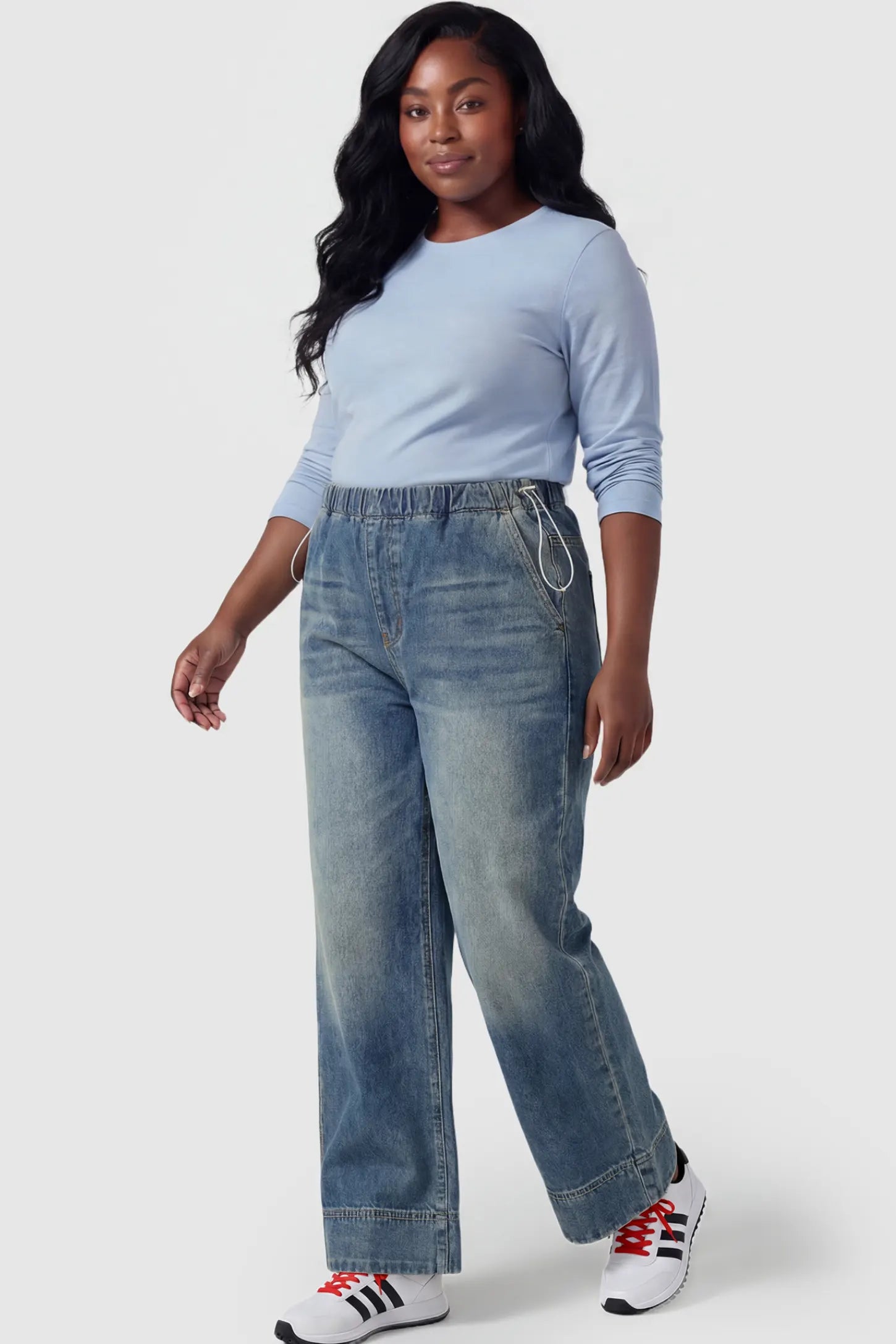 Drawstring Wide-Leg Maternity Jeans Drawstring Wide-Leg Maternity Jeans in vintage blue featuring adjustable waist and relaxed full-length silhouette on plus size pregnant model front view.
