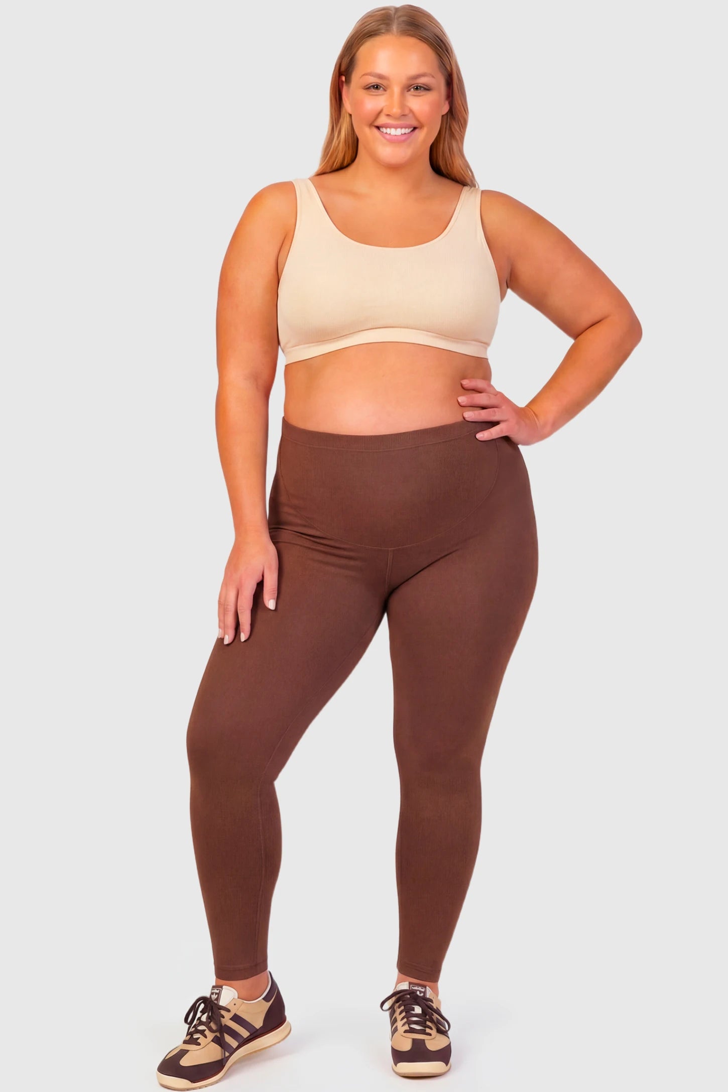 Full-Panel Ankle-Length Maternity Yoga Leggings Full-Panel Ankle-Length Maternity Yoga Leggings in coffee featuring over-the-belly support and full-length fit on plus size pregnant model.