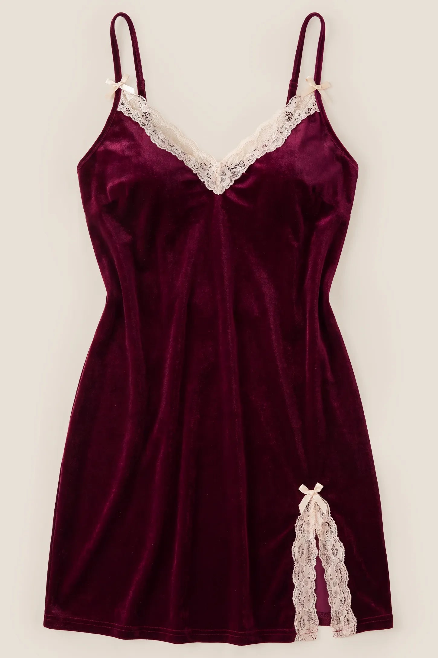 Elegant V-Neck Velvet Maternity Slip Nightdress Product detail view of the Bumpbabe Elegant V-Neck Velvet Maternity Slip Nightdress in Burgundy, highlighting lace trim accents, stretchy fabric, and a side slit.