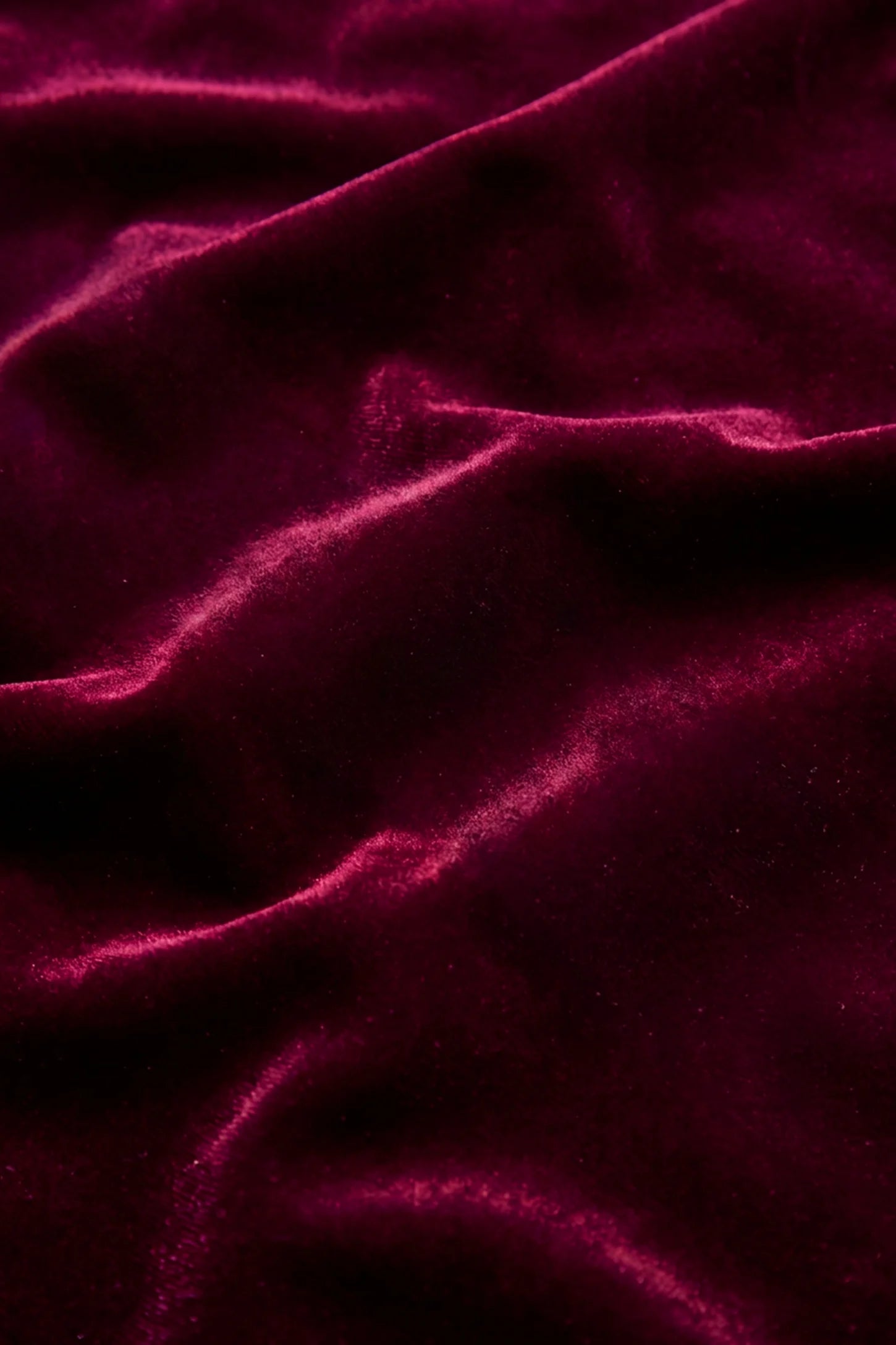 Elegant V-Neck Velvet Maternity Slip Nightdress Close-up fabric shot of the Bumpbabe Elegant V-Neck Velvet Maternity Slip Nightdress in Burgundy, displaying the rich texture of soft, comfortable, and stretchy velvet material.