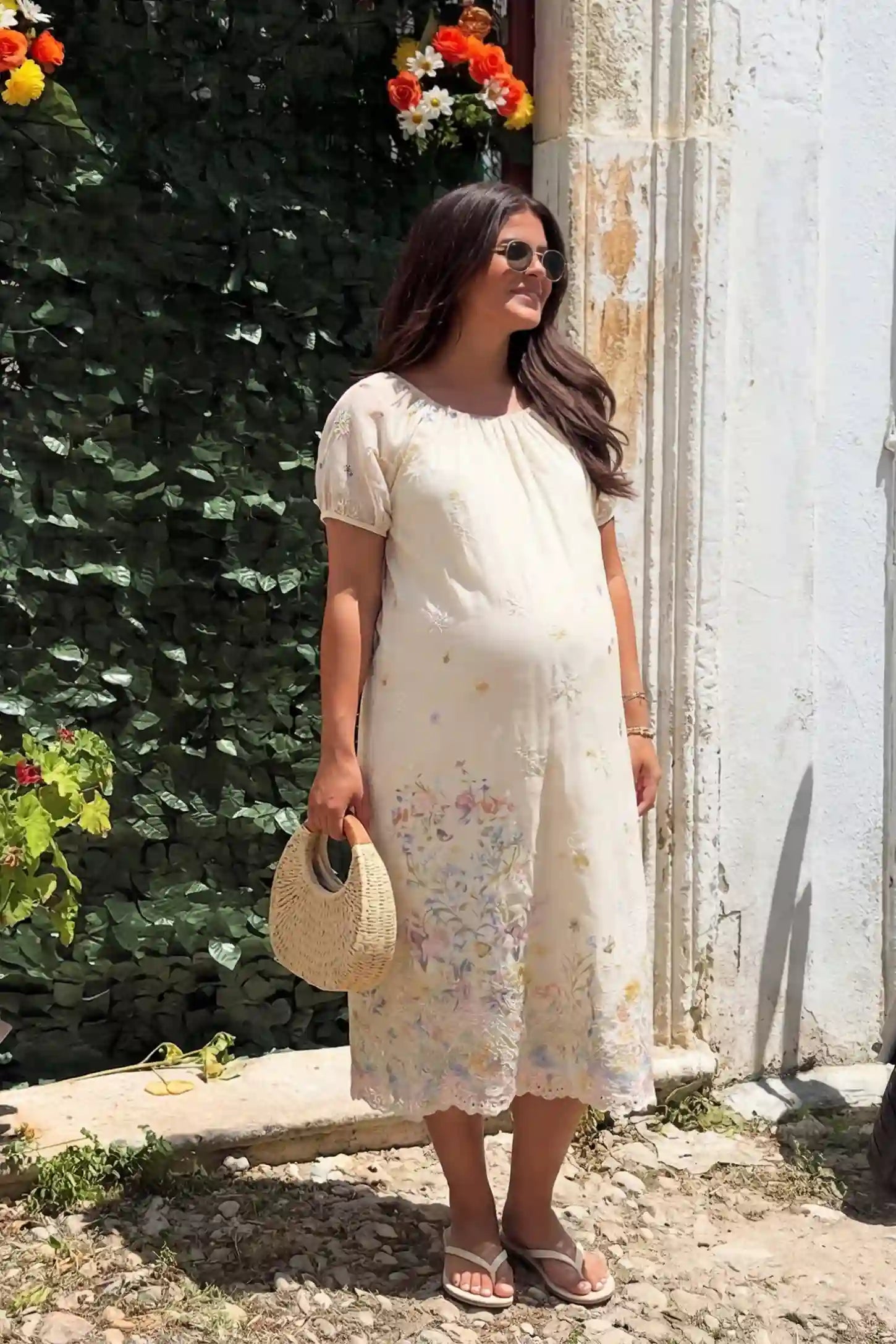 Embroidered floral convertible neckline maternity midi dress in beige with embroidered floral detail and puff sleeves, front view on pregnant model
