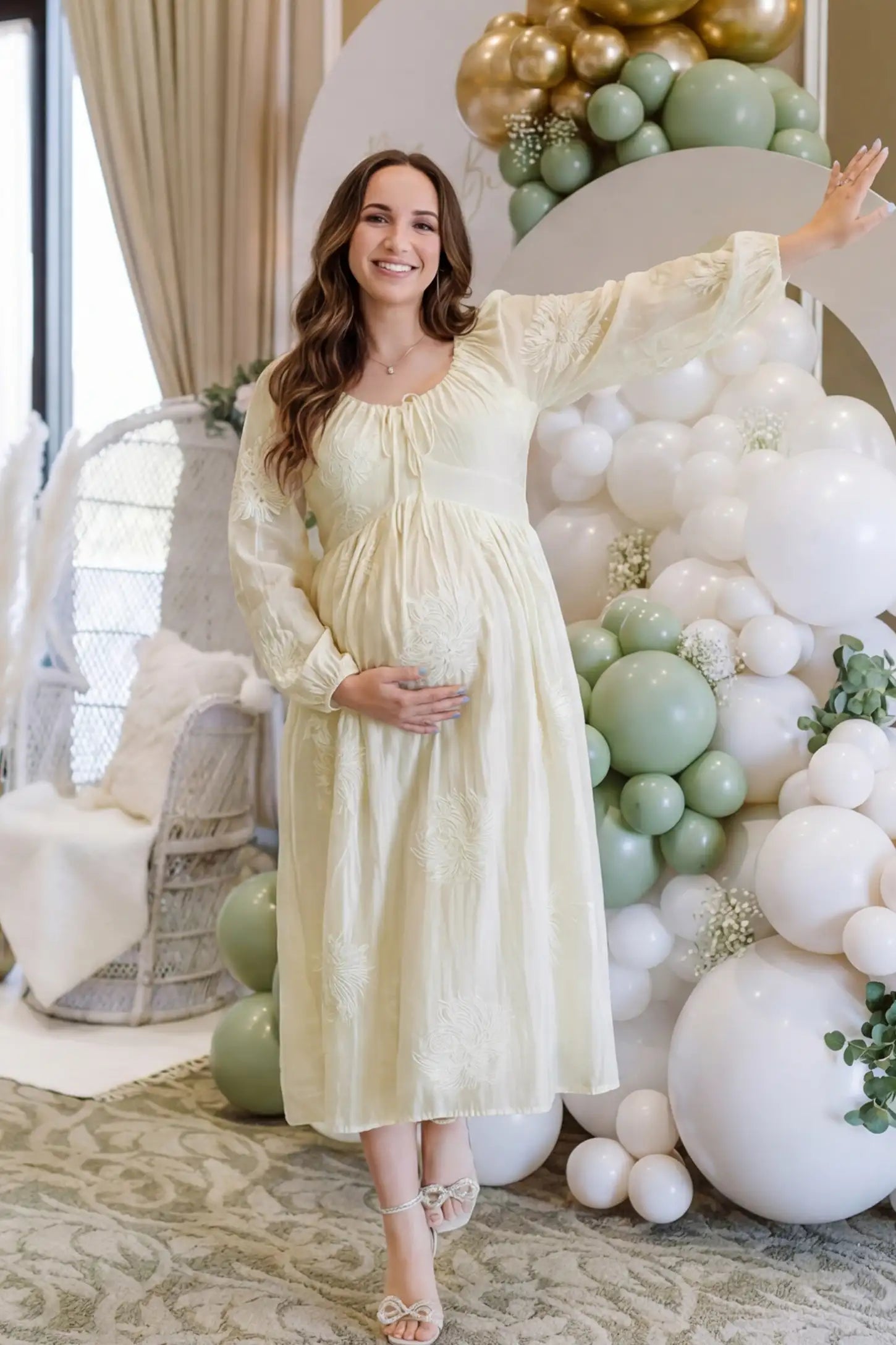 Embroidered floral gathered tie front maternity midi dress in pale yellow with delicate floral embroidery, front view on pregnant model
