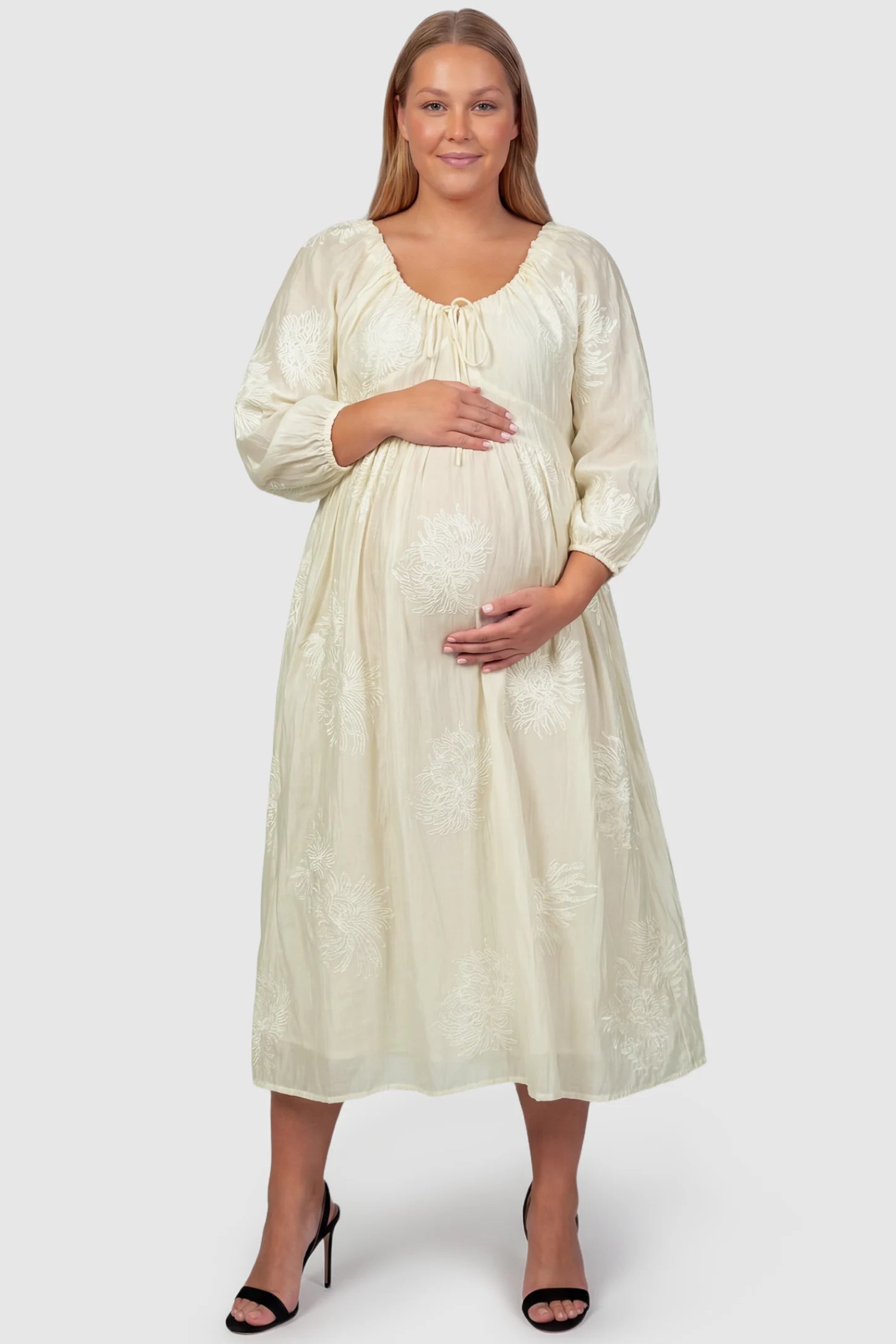 Embroidered Floral Gathered Tie Front Maternity Midi Dress Embroidered floral gathered tie front maternity midi dress in pale yellow with delicate floral embroidery, front view on plus-size model