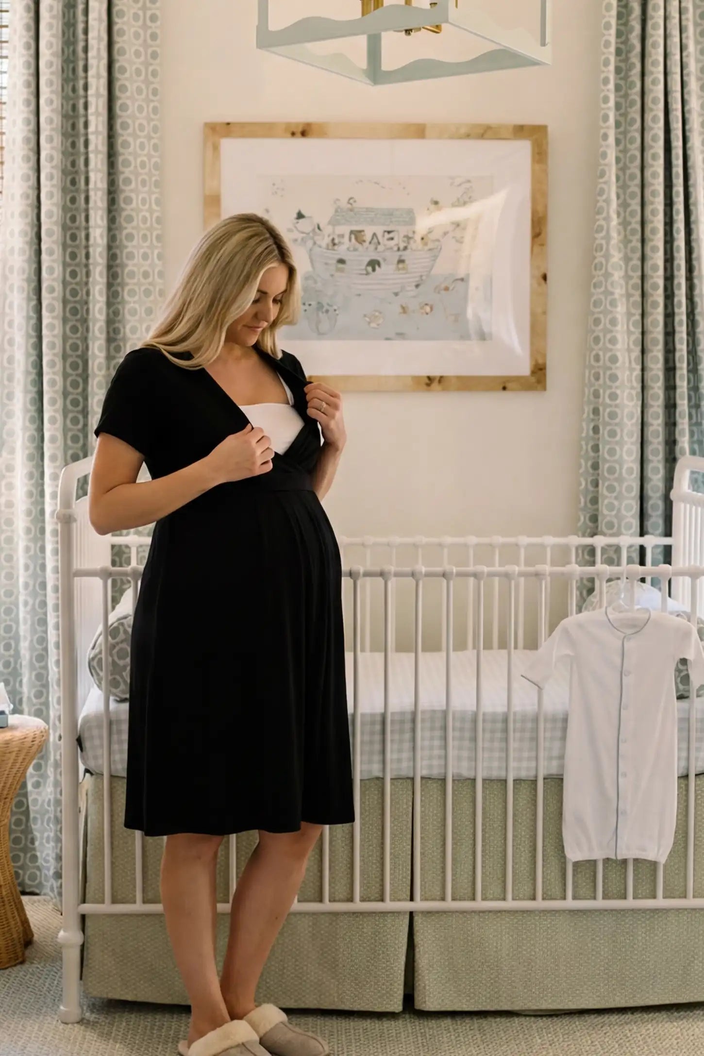 V-Neck Empire Waist Short Maternity & Nursing Dress V-Neck Empire Waist Short Maternity and Nursing Dress in black featuring easy nursing access in full body front view on a editorial lifestyle model