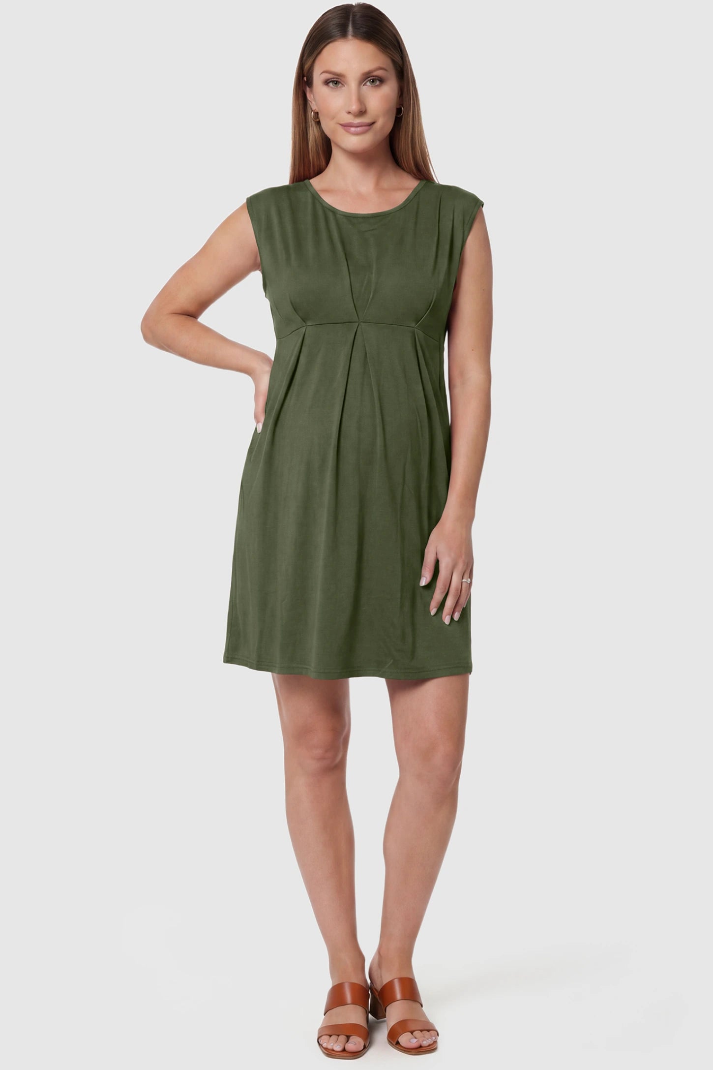 Sleeveless Empire Waist Maternity Short Dress Sleeveless empire waist maternity short dress in army green with short length and sleeveless design, front view on pregnant model