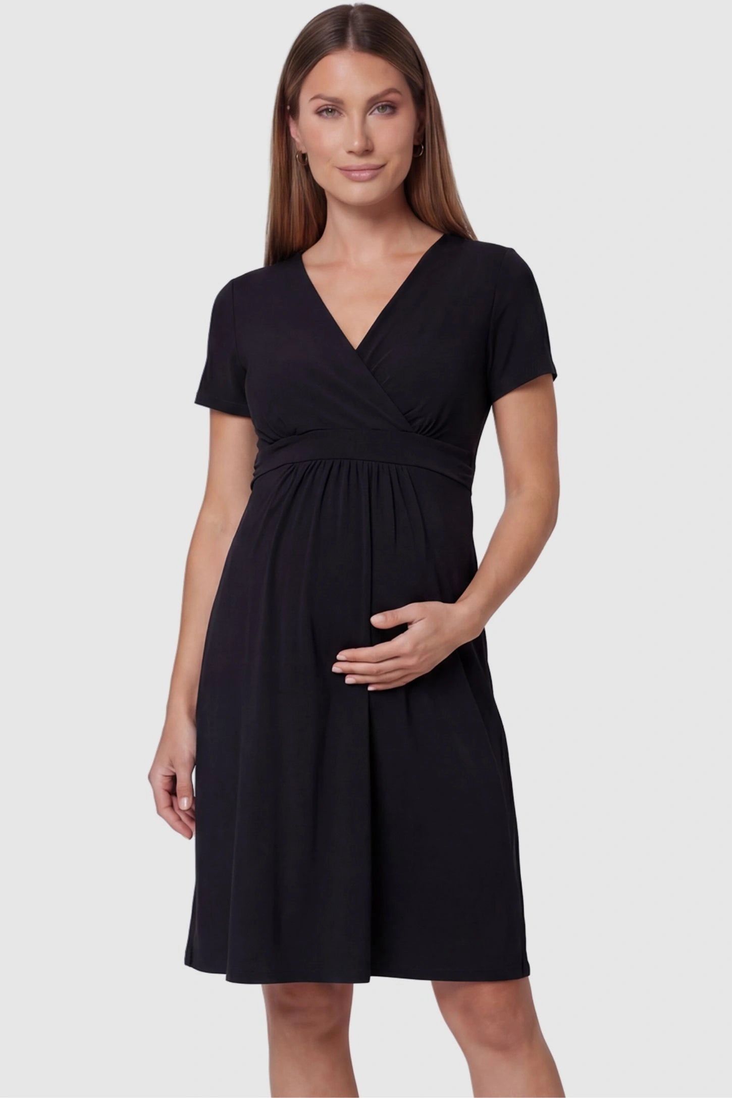 V-Neck Empire Waist Short Maternity & Nursing Dress V-Neck Empire Waist Short Maternity and Nursing Dress in black featuring A-line silhouette in full body front view on a pregnant model