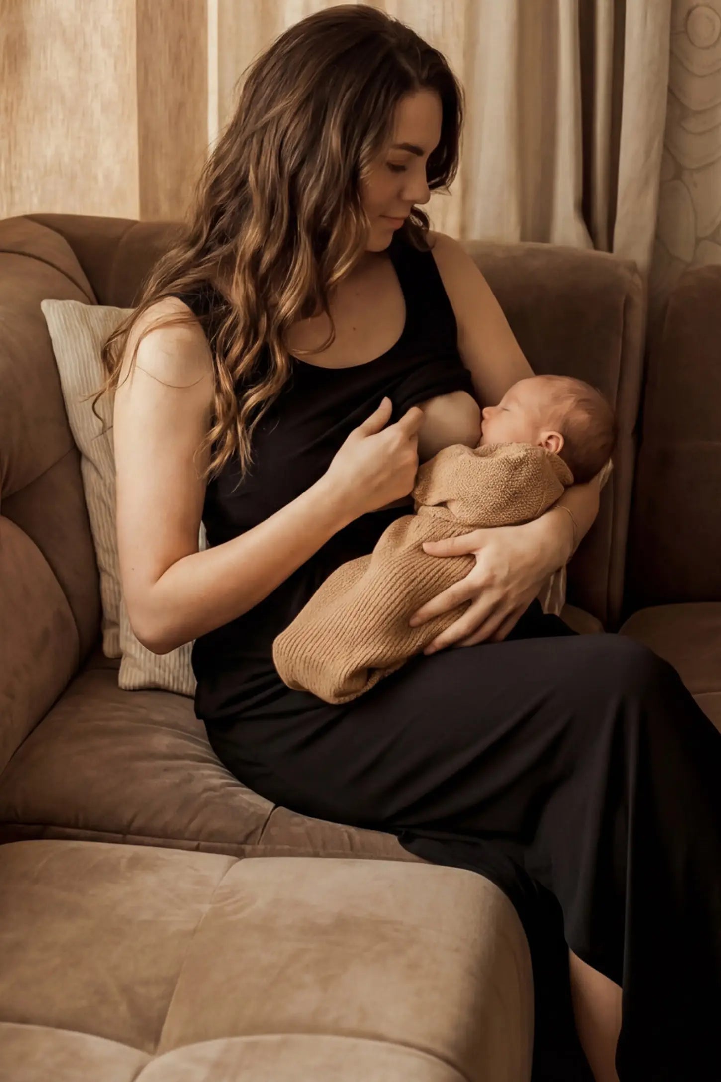 Sleeveless Empire Waist Maternity & Nursing Maxi Dress Sleeveless Empire Waist Maternity & Nursing Maxi Dress in black featuring , nursing access on a model in a room setting.