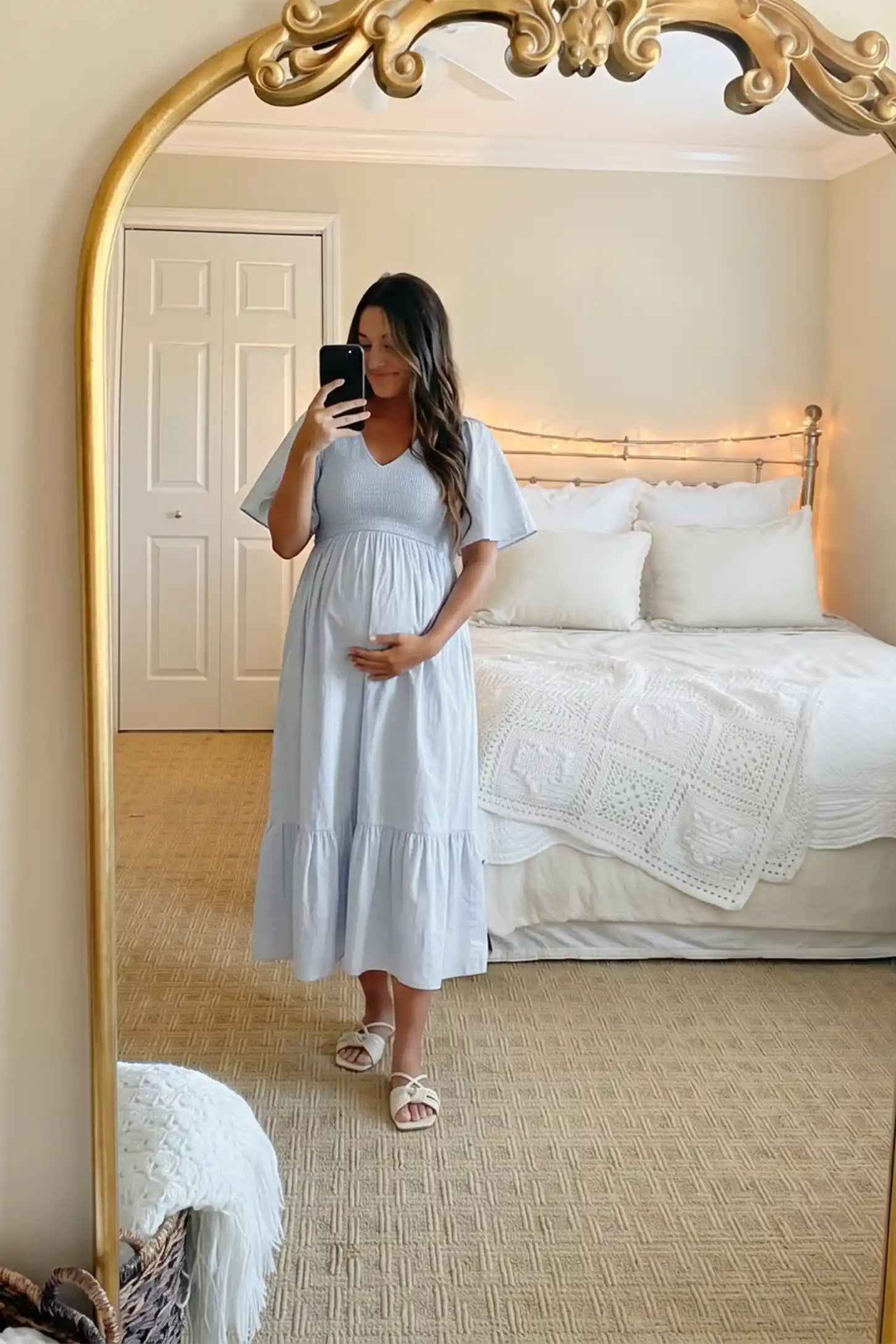 Smocked Empire Waist Tiered Skirt Maternity Midi Dress Smocked empire waist tiered skirt maternity midi dress in light blue with V-neckline and stretchy smocked bodice, UGC mirror selfie view