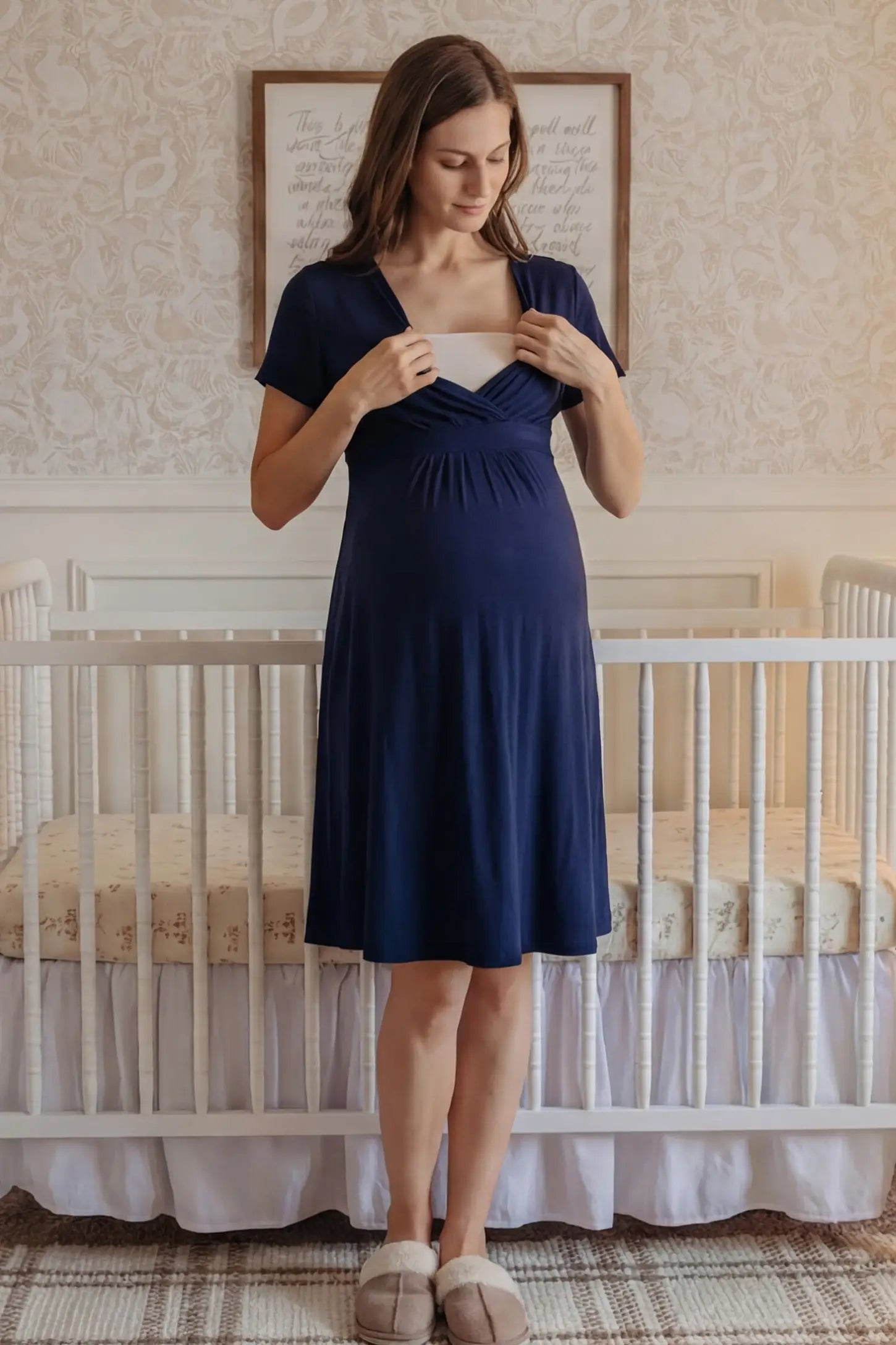 V-Neck Empire Waist Short Maternity & Nursing Dress V-Neck Empire Waist Short Maternity and Nursing Dress in navy blue featuring easy nursing access in full body front view on a UGC model