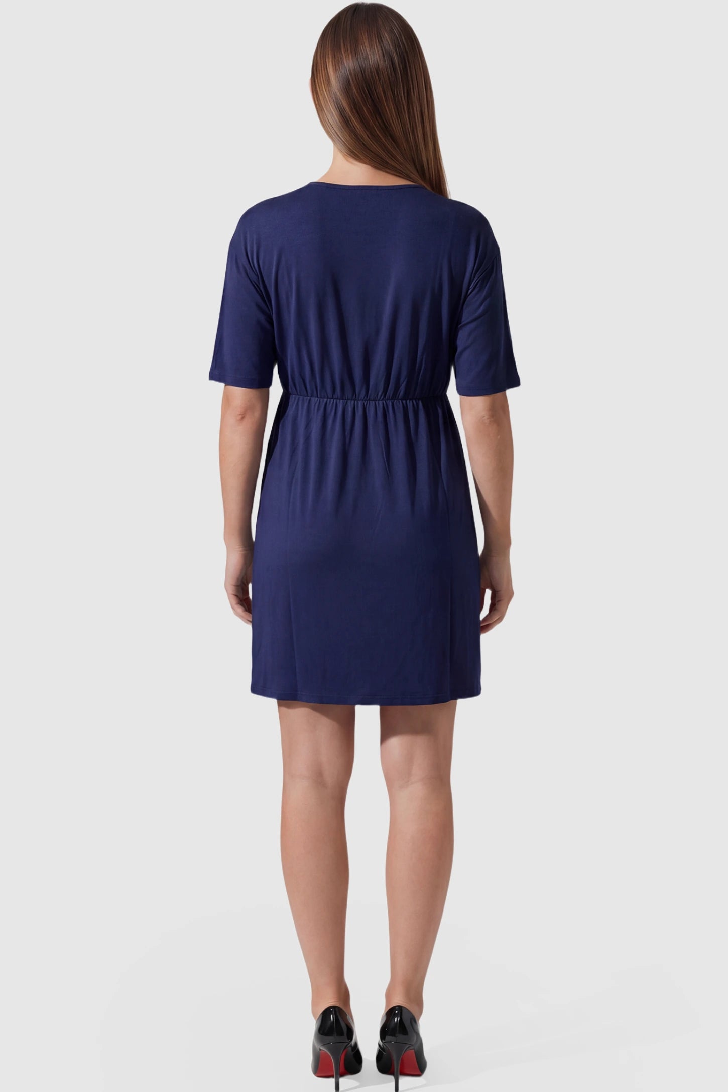 Wrap Front Empire Waist Maternity & Nursing Mini Dress Wrap Front Empire Waist Maternity & Nursing Dress in navy blue featuring short sleeves on pregnant model back view