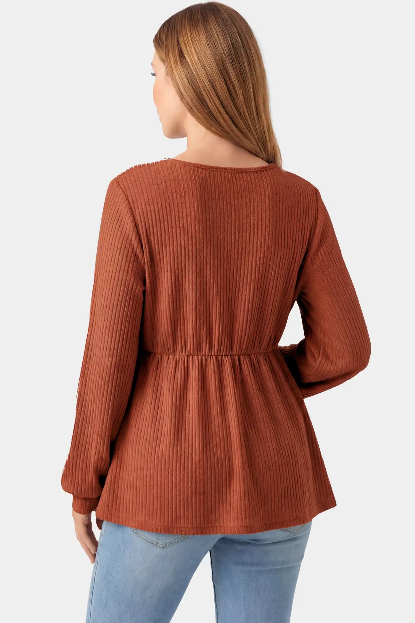 Ribbed Knit Empire Waist Maternity Top Ribbed Knit Empire Waist Maternity Top in brown featuring a v-neckline and ribbed knit texture on a pregnant model.