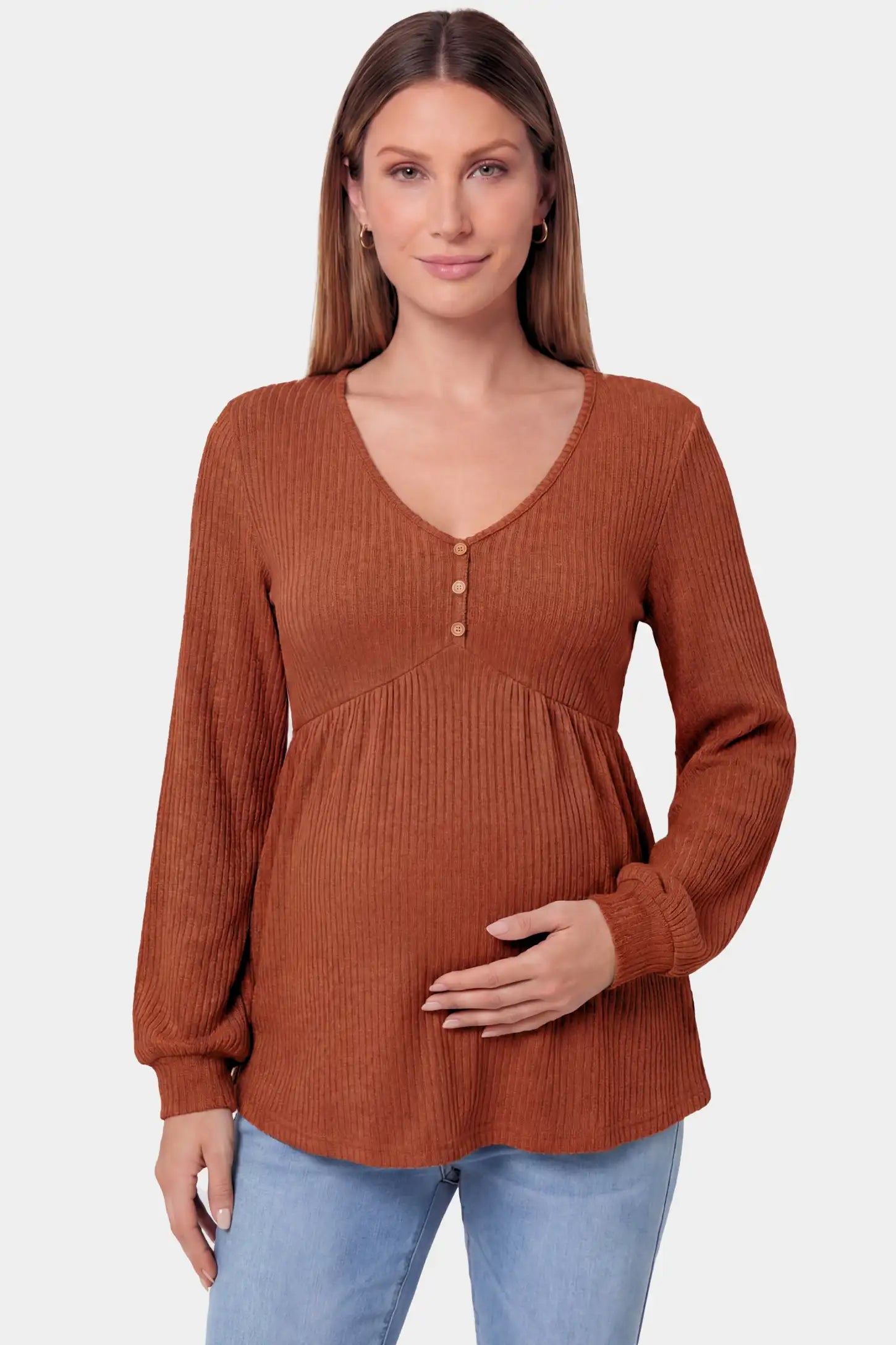 Ribbed Knit Empire Waist Maternity Top in brown featuring a v-neckline and ribbed knit texture on a pregnant model.