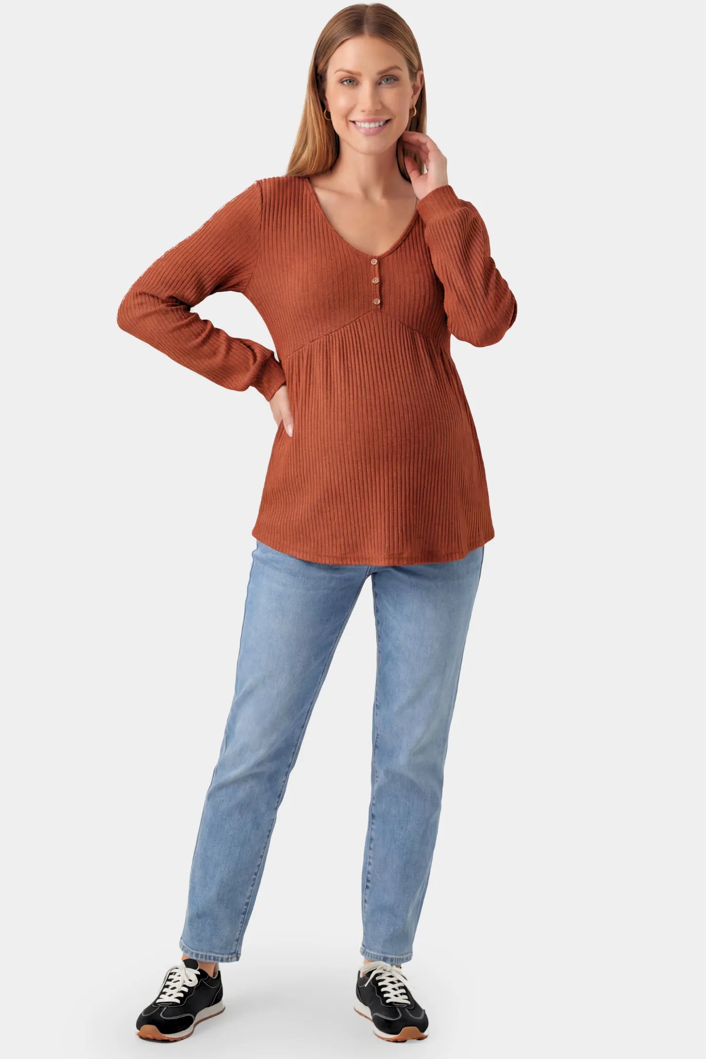 Ribbed Knit Empire Waist Maternity Top Ribbed Knit Empire Waist Maternity Top in brown featuring a v-neckline and ribbed knit texture on a pregnant model.