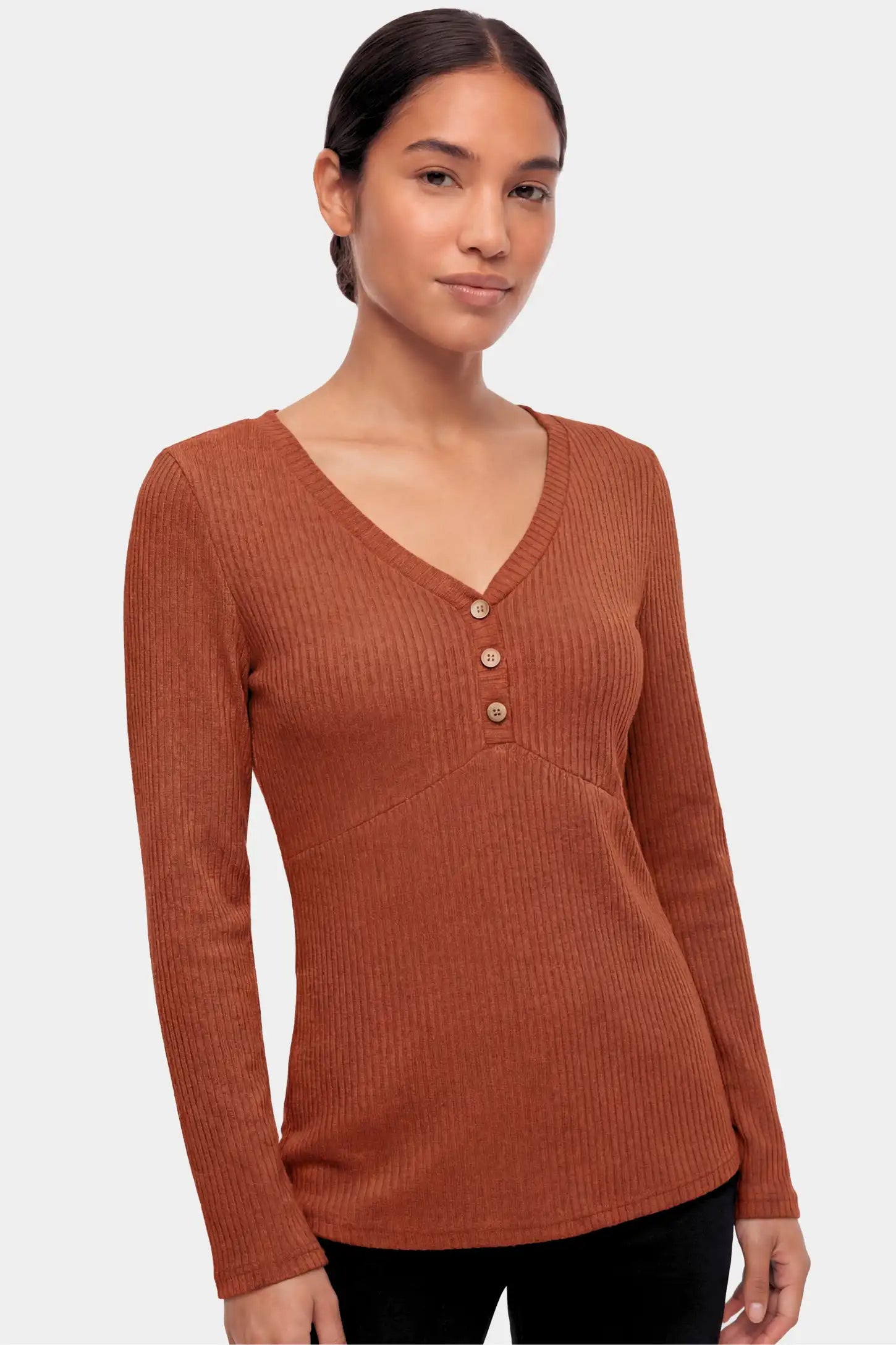 Ribbed Knit Empire Waist Maternity Top Ribbed Knit Empire Waist Maternity Top in brown featuring a v-neckline and ribbed knit texture on a non pregnant model.