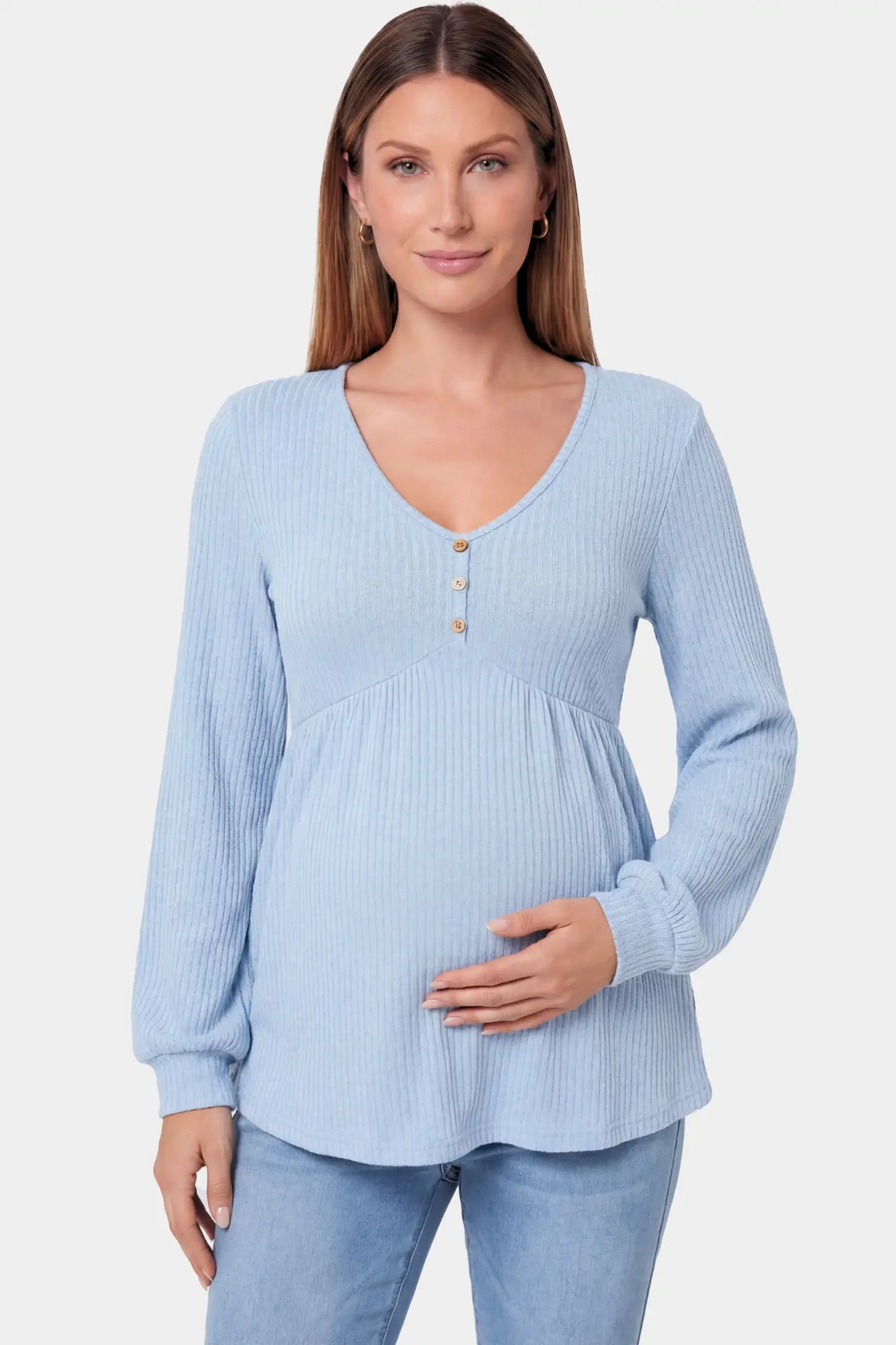 Ribbed Knit Empire Waist Maternity Top Ribbed Knit Empire Waist Maternity Top in light blue featuring a v-neckline and ribbed knit texture on a pregnant model.