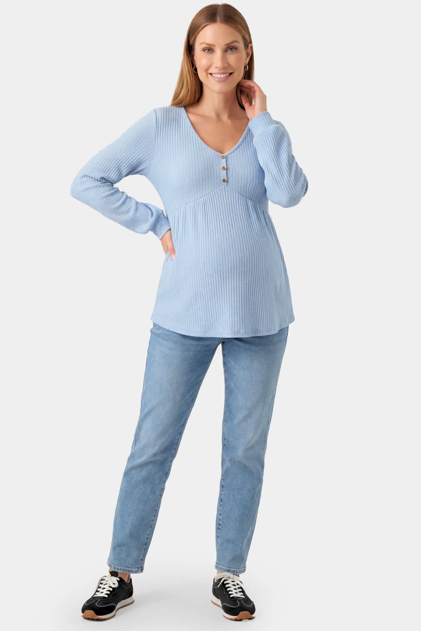 Ribbed Knit Empire Waist Maternity Top Ribbed Knit Empire Waist Maternity Top in light blue featuring a v-neckline and ribbed knit texture on a pregnant model.