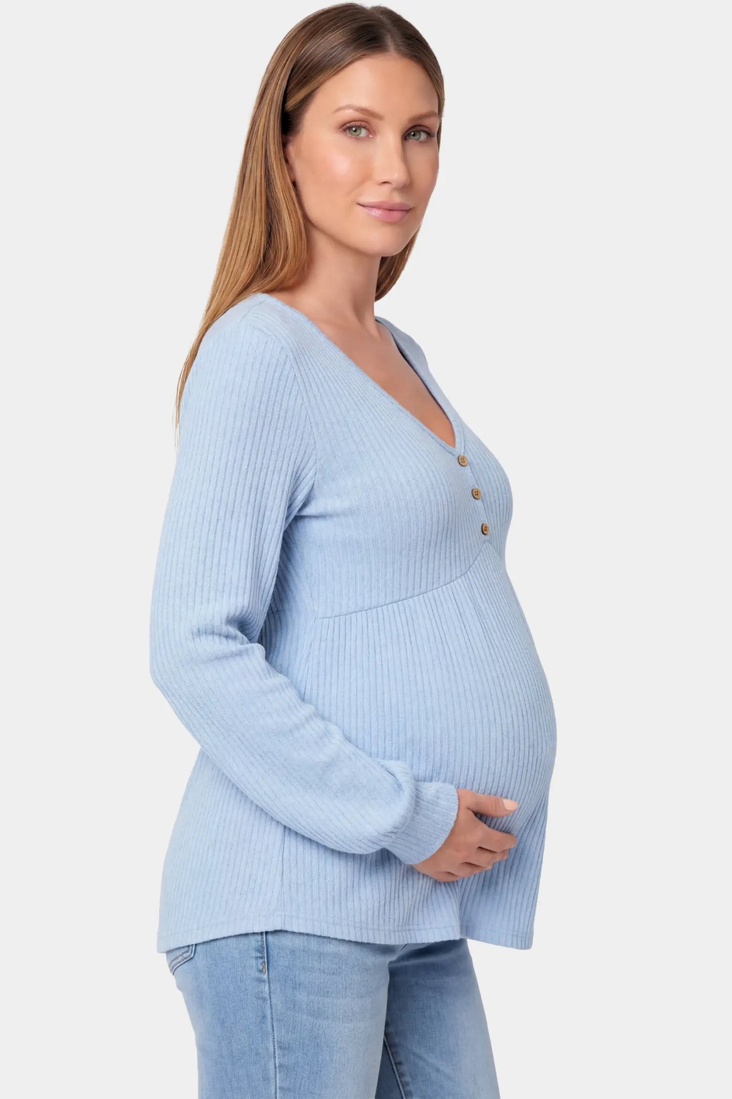 Ribbed Knit Empire Waist Maternity Top Ribbed Knit Empire Waist Maternity Top in light blue featuring a v-neckline and ribbed knit texture on a pregnant model.