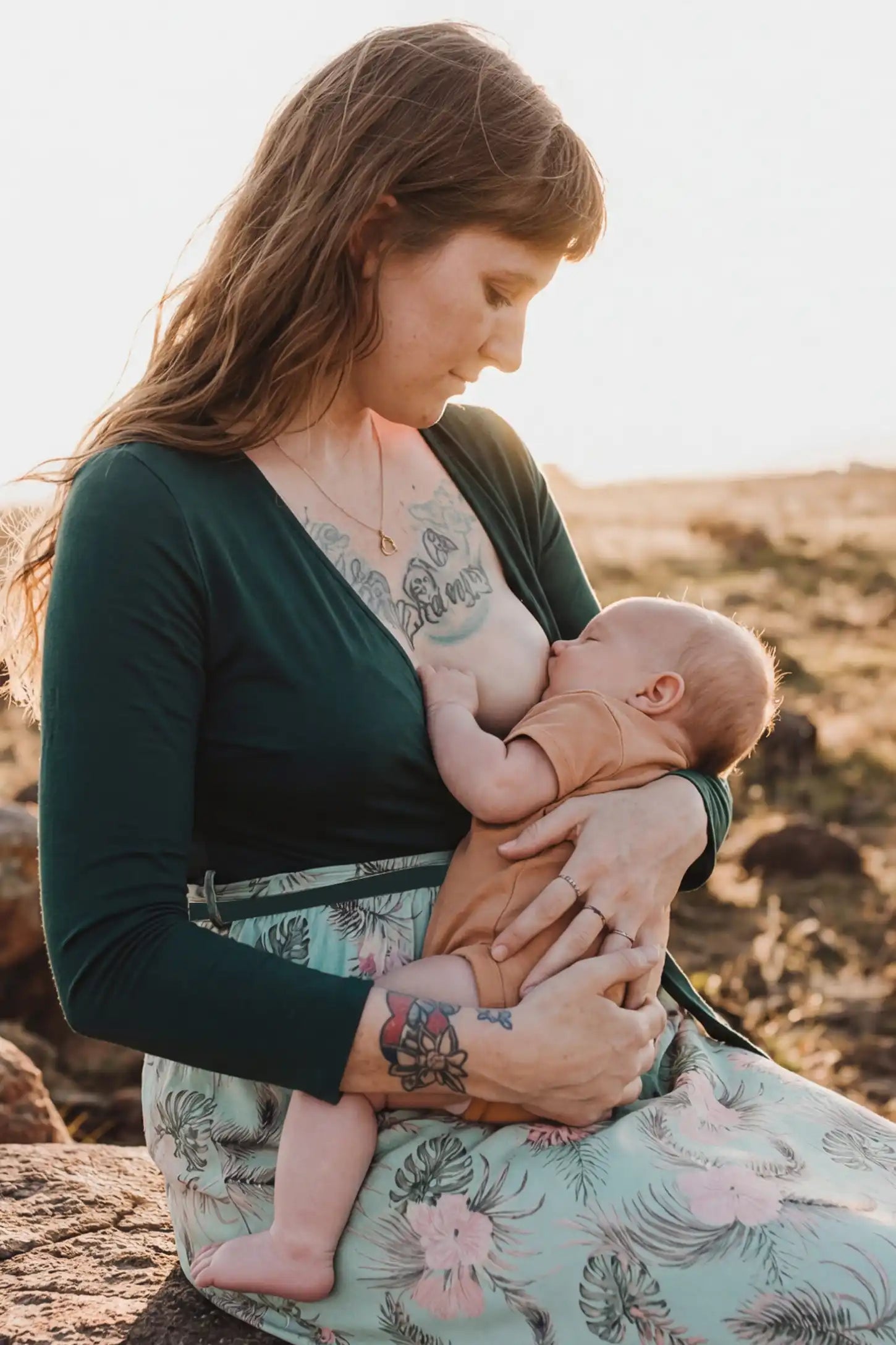 Empire Waist Faux Wrap Maternity & Nursing Midi Dress Empire Waist Faux Wrap Maternity & Nursing Midi Dress in green floral featuring long sleeves and V-neck wrap detail on a non pregnant model.