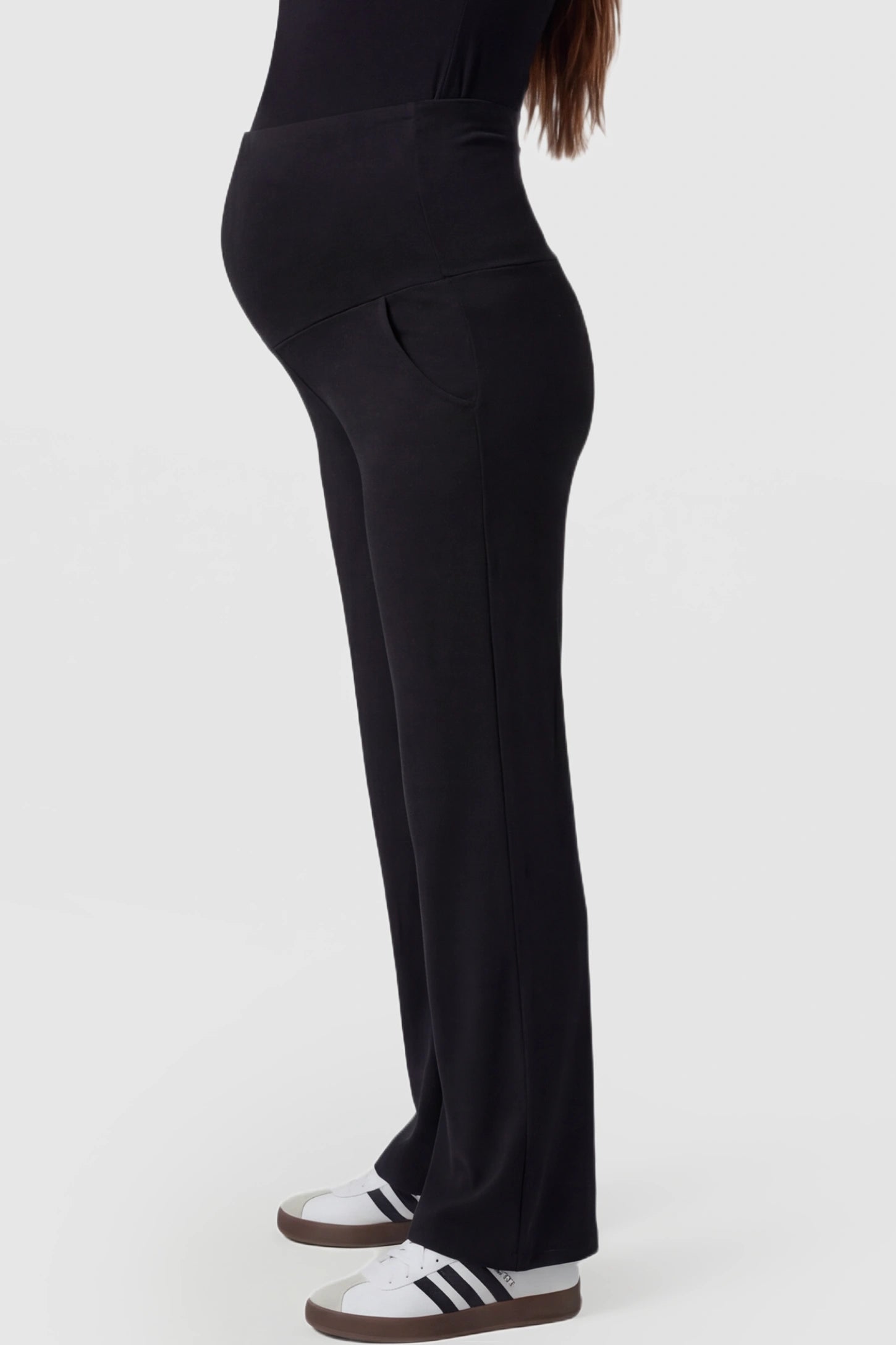 High Waist Full Panel Flare Leg Maternity Pants High Waist Full Panel Flare Leg Maternity Pants in black featuring over-the-belly high stretch fit on pregnant model.