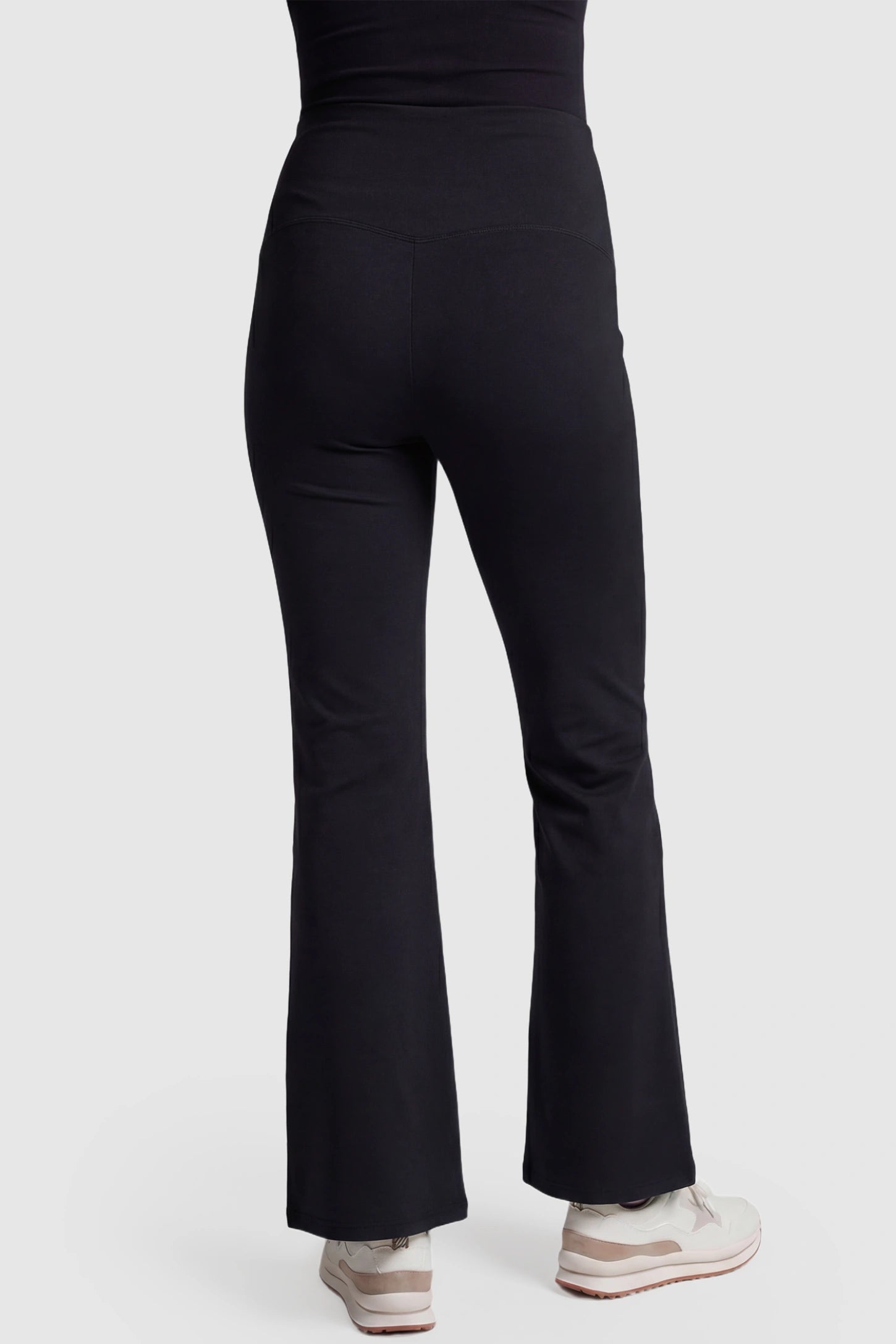Full-Panel Flared Maternity Pants Full-Panel Flared Maternity Pants in black featuring high-waisted bump panel and full-length bootcut silhouette on pregnant model.