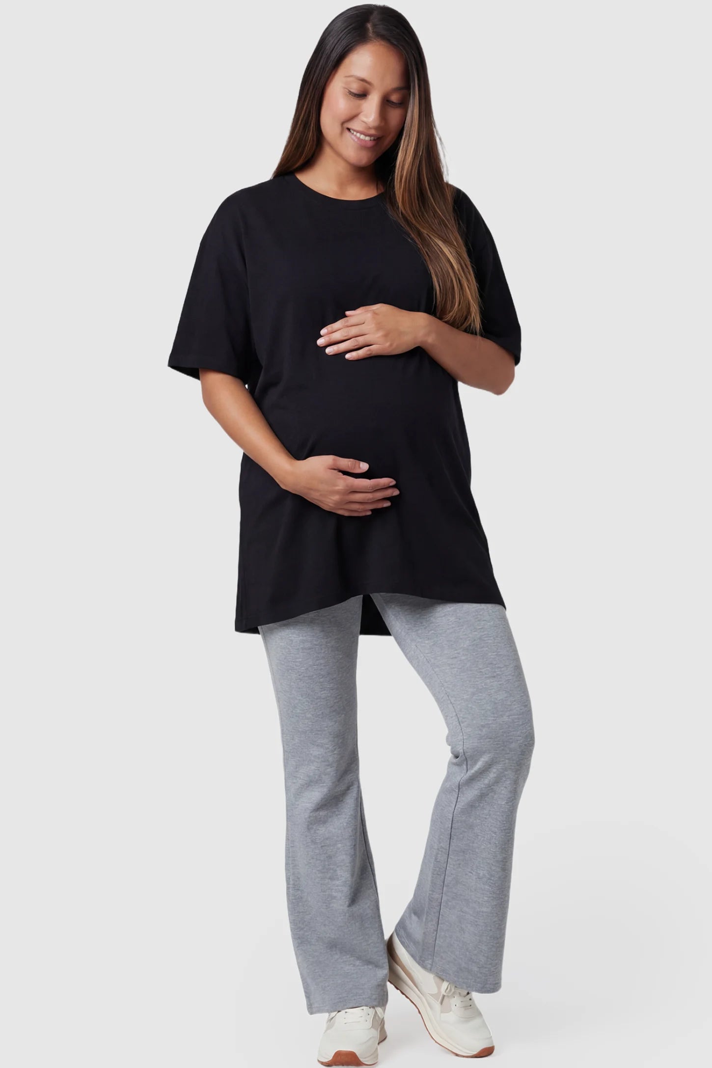 Full-Panel Flared Maternity Pants Full-Panel Flared Maternity Pants in gray featuring high-waisted bump panel and full-length bootcut silhouette on pregnant model.