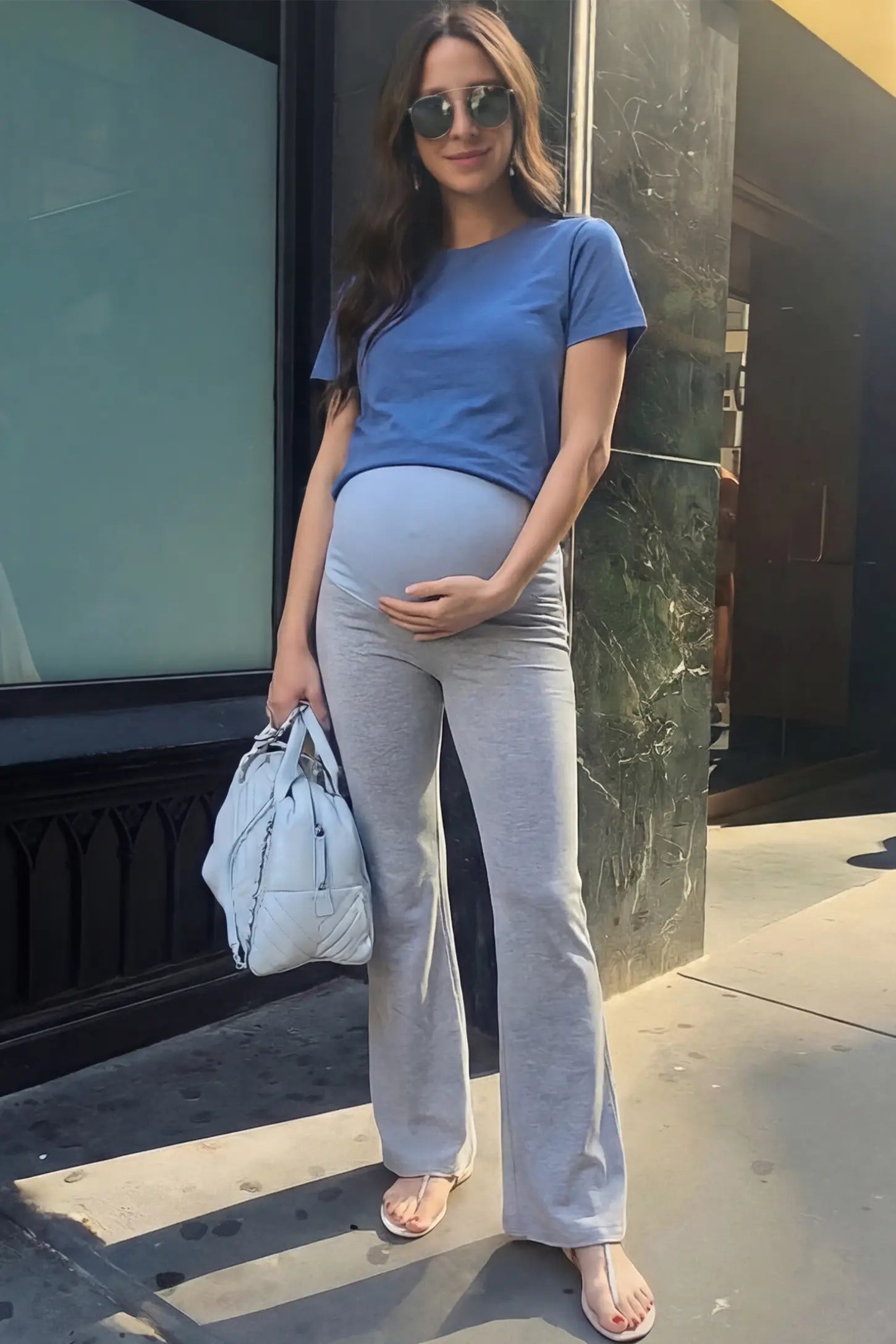 Full-Panel Flared Maternity Pants Full-Panel Flared Maternity Pants in gray featuring high-waisted bump panel and full-length bootcut silhouette on pregnant model.