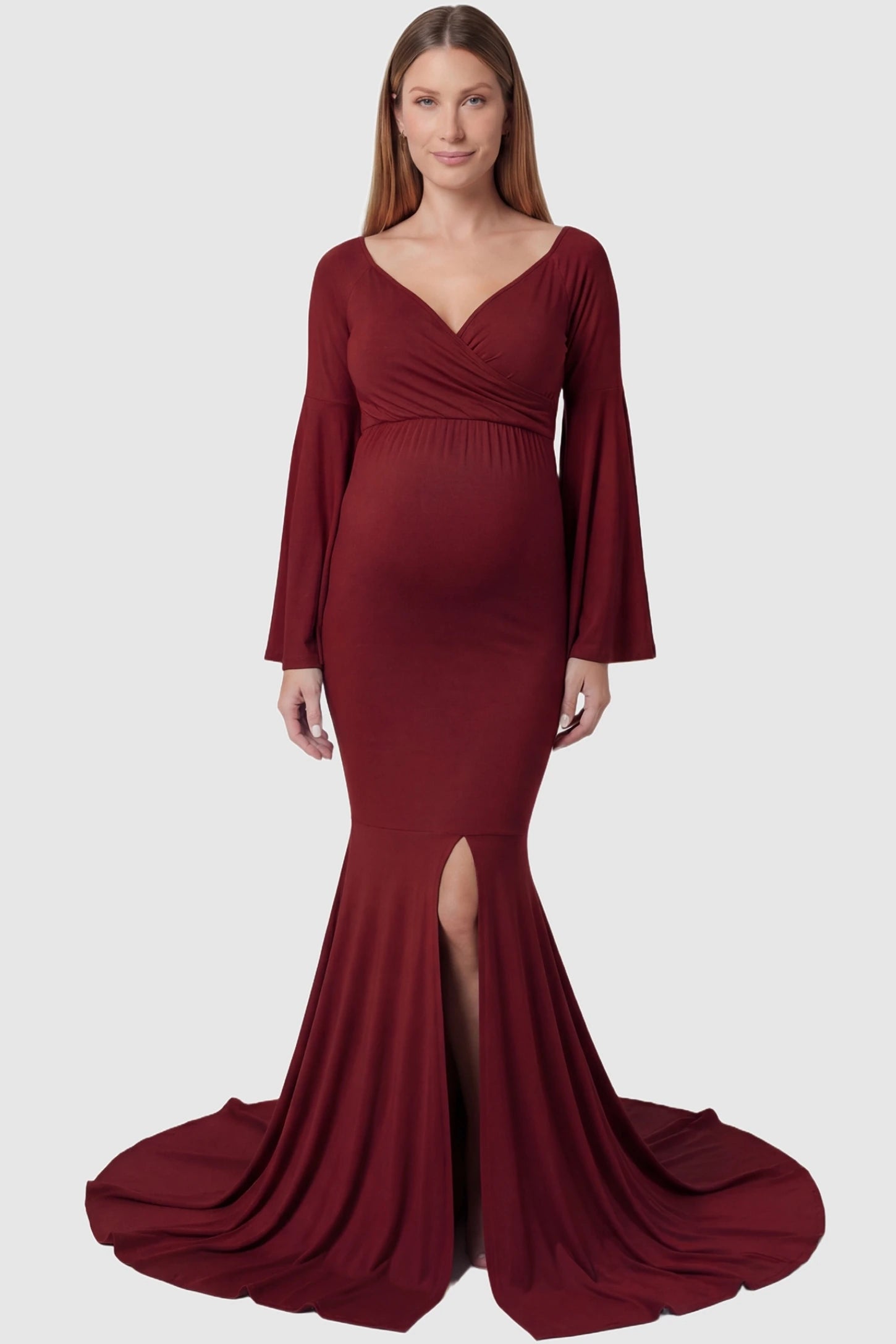 Wrap Flared Fishtail Maternity Gown Wrap Flared Fishtail Maternity Gown in Burgundy featuring a sweetheart neckline on a pregnant model front view.