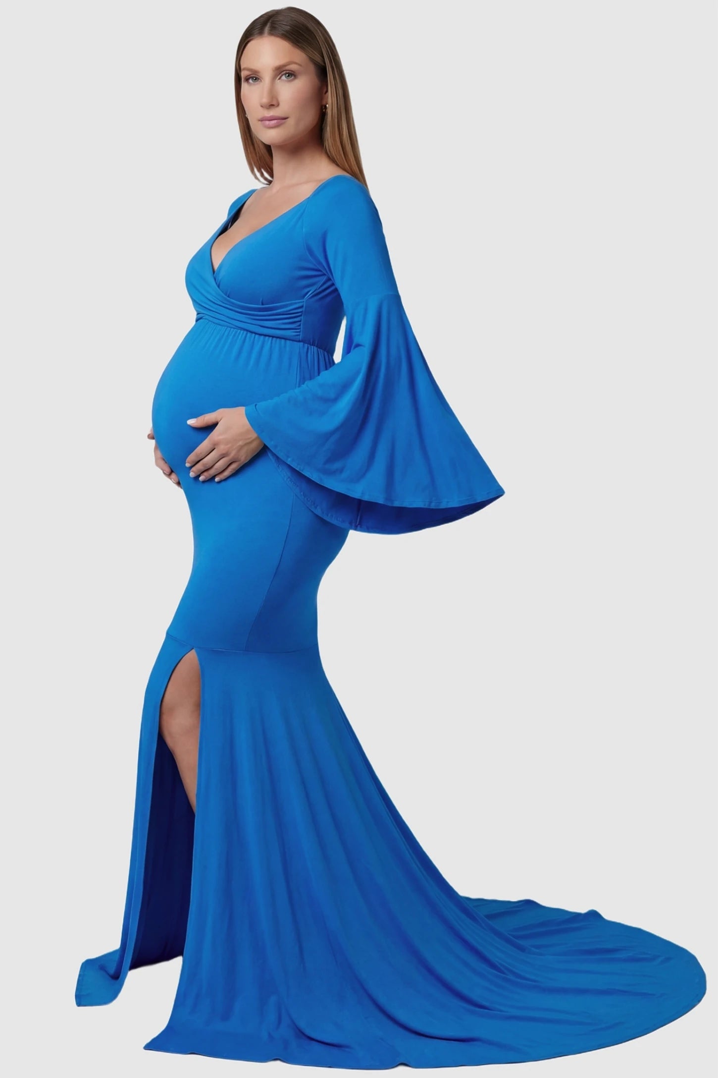 Wrap Flared Fishtail Maternity Gown Wrap Flared Fishtail Maternity Gown in Denim Blue featuring a long train on a pregnant model side view.