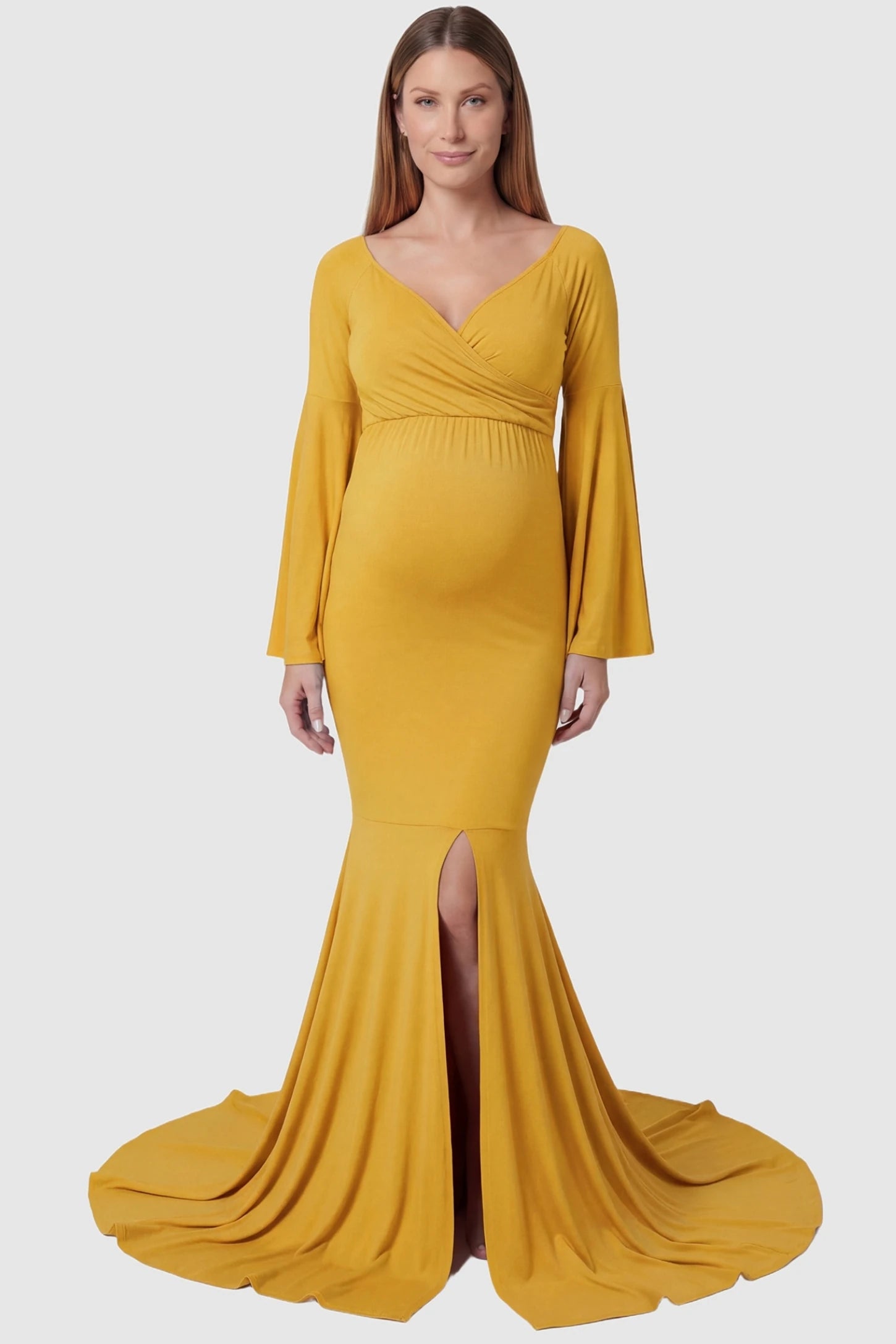 Wrap Flared Fishtail Maternity Gown Wrap Flared Fishtail Maternity Gown in Golden Yellow featuring a sweetheart neckline on a pregnant model front view.