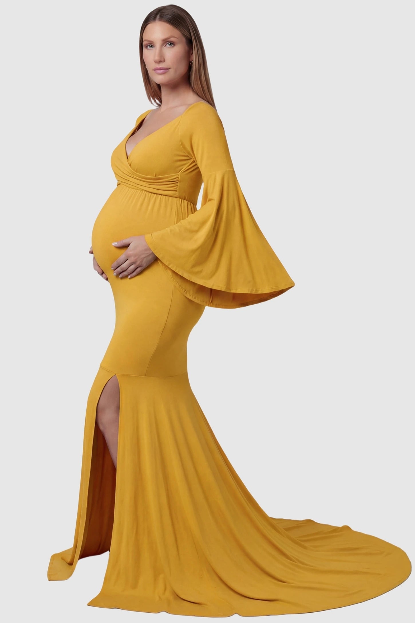 Wrap Flared Fishtail Maternity Gown Wrap Flared Fishtail Maternity Gown in Golden Yellow featuring a long train on a pregnant model side view.