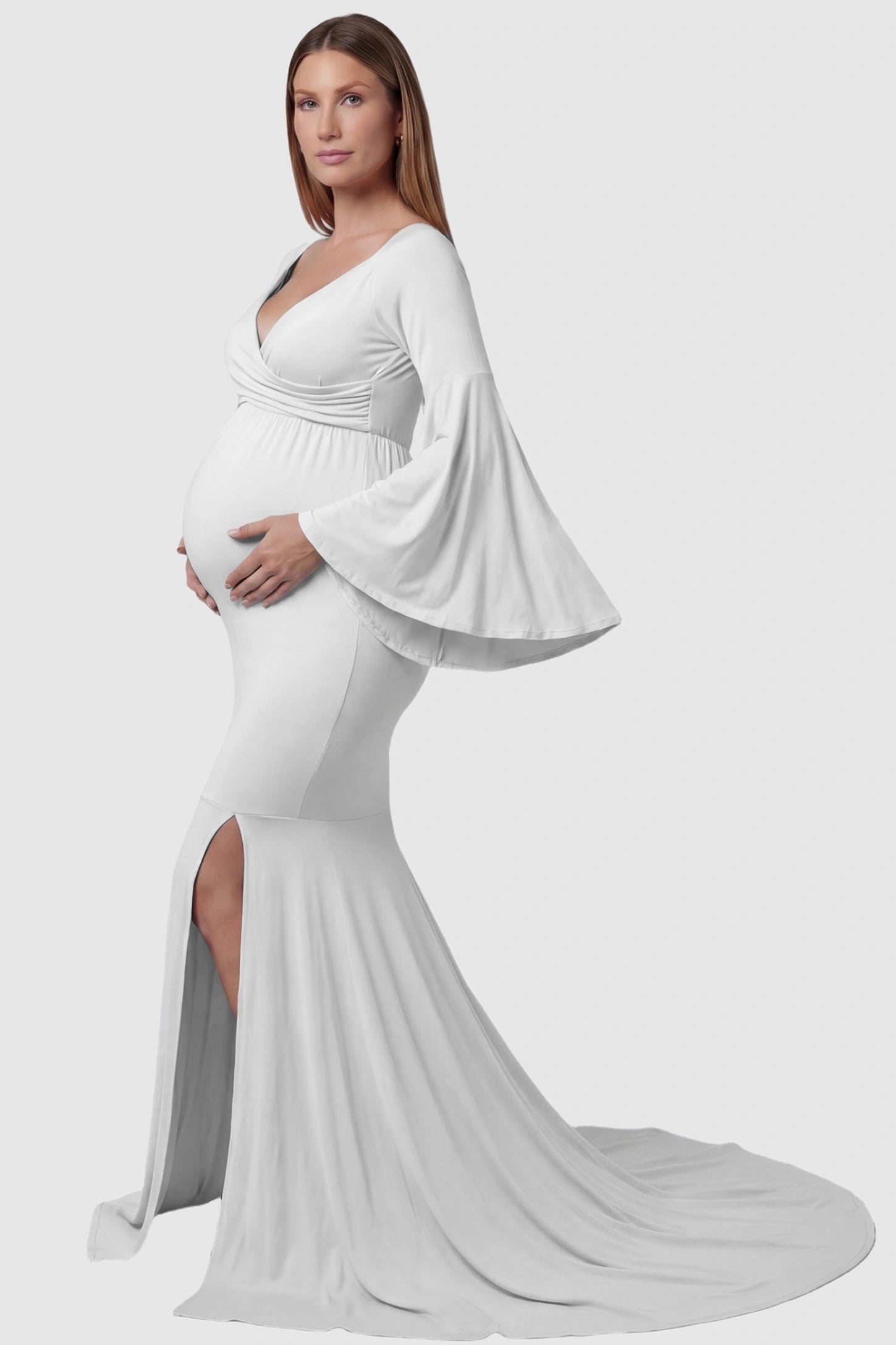 Wrap Flared Fishtail Maternity Gown Wrap Flared Fishtail Maternity Gown in White featuring a dramatic long train on a pregnant model side view.