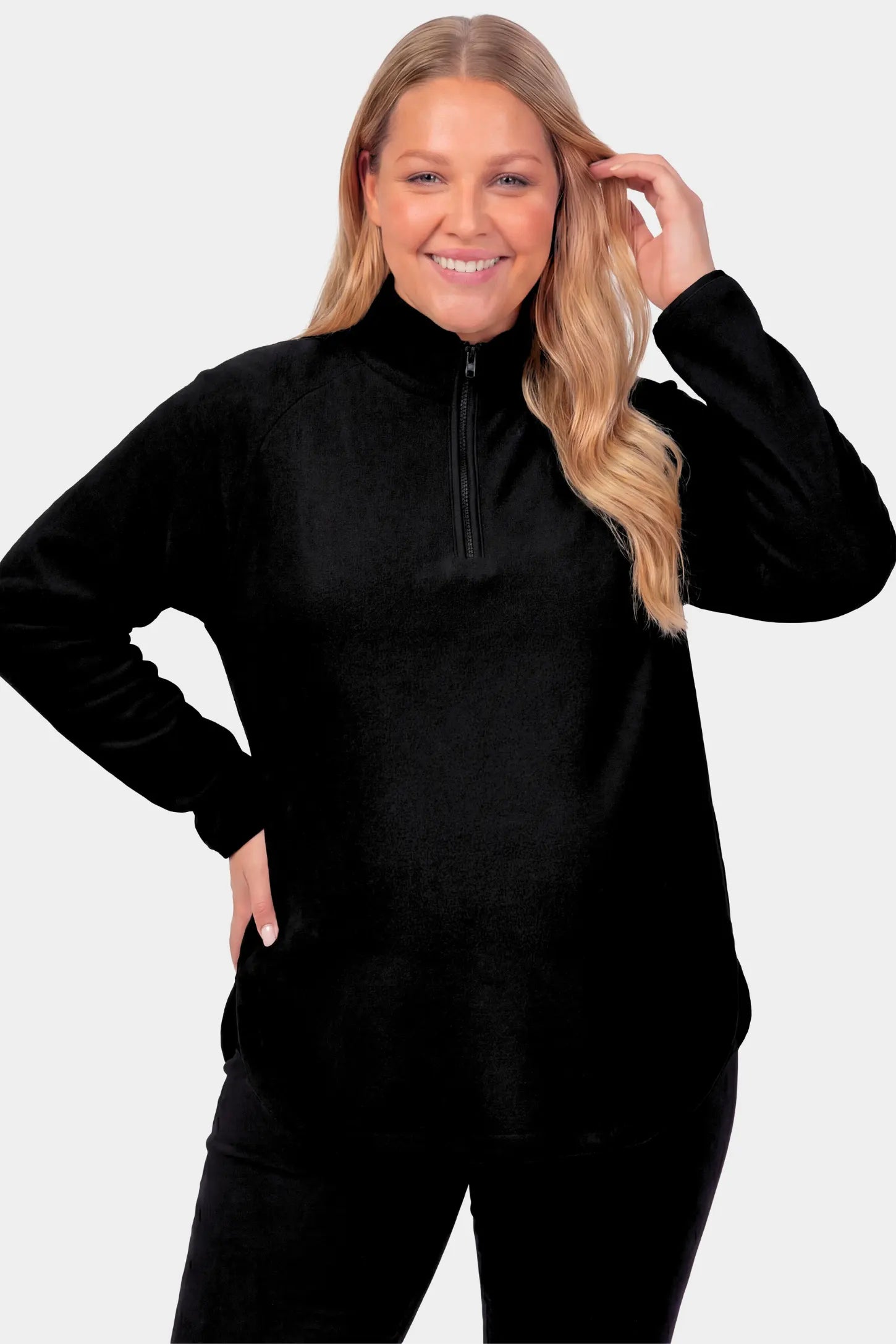 Fleece Mock Neck with Half-Zip Maternity Sweater in black featuring a mock neck and half-zip detail on a pregnant model.