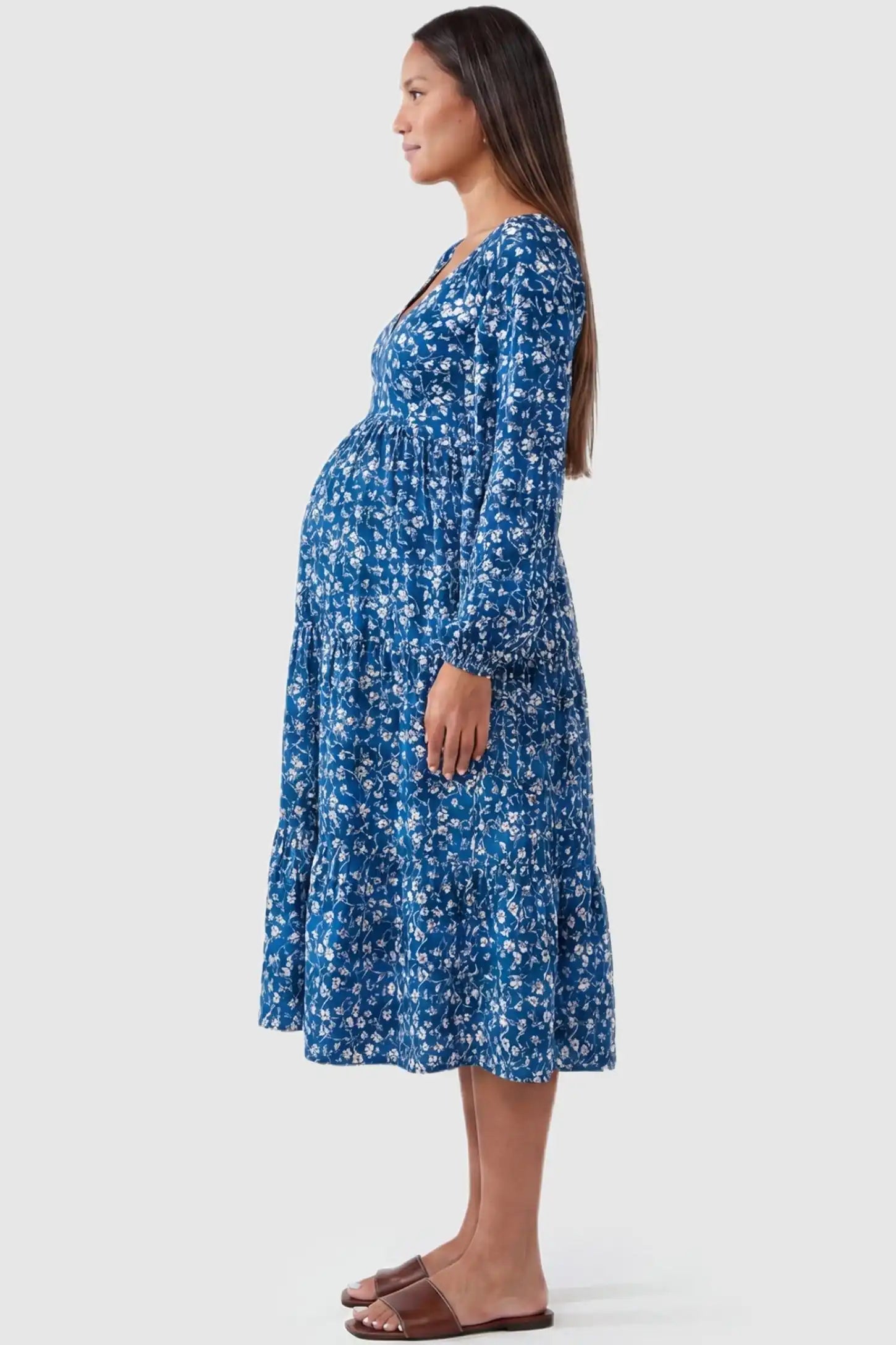 Floral Balloon Sleeves Midi Maternity Dress Blue Floral Balloon Sleeves Midi Maternity Dress featuring a tiered skirt on a side-profile pregnant model.