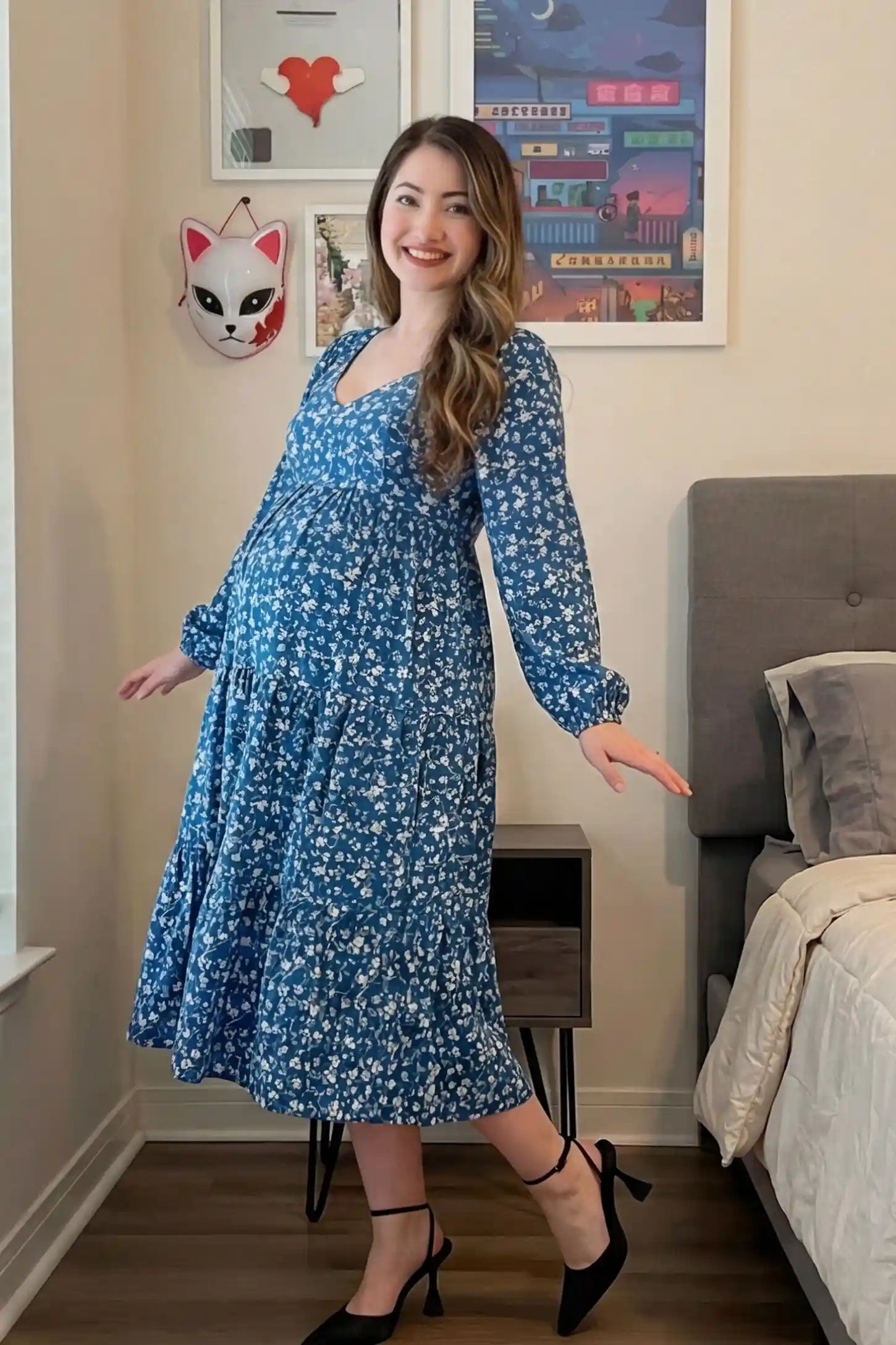 Floral Balloon Sleeves Midi Maternity Dress Blue Floral Balloon Sleeves Midi Maternity Dress featuring a tiered skirt on a side-profile pregnant model.