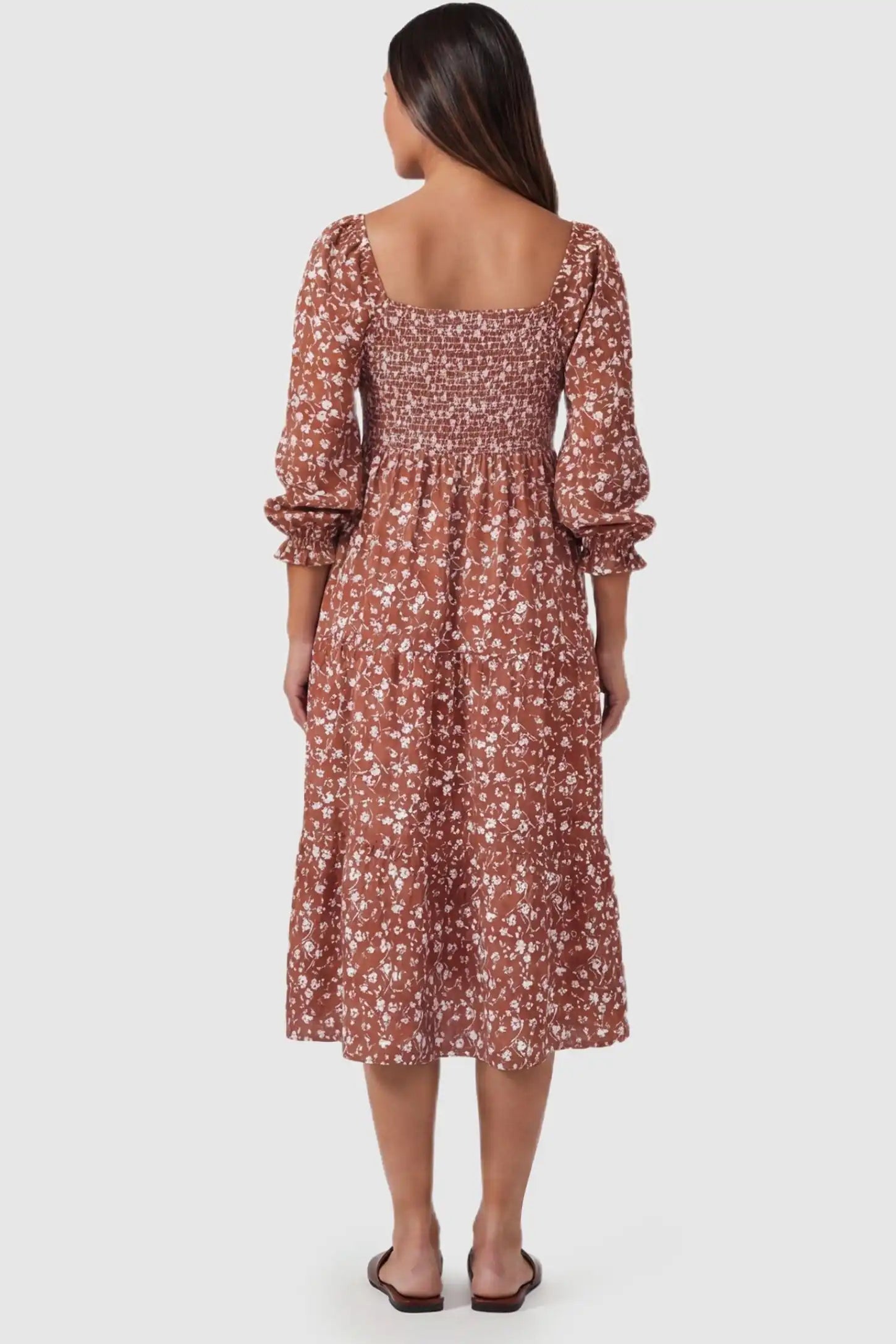 Floral Balloon Sleeves Midi Maternity Dress Floral Balloon Sleeves Midi Maternity Dress in Brown featuring a smocked back on a rear-view pregnant model.