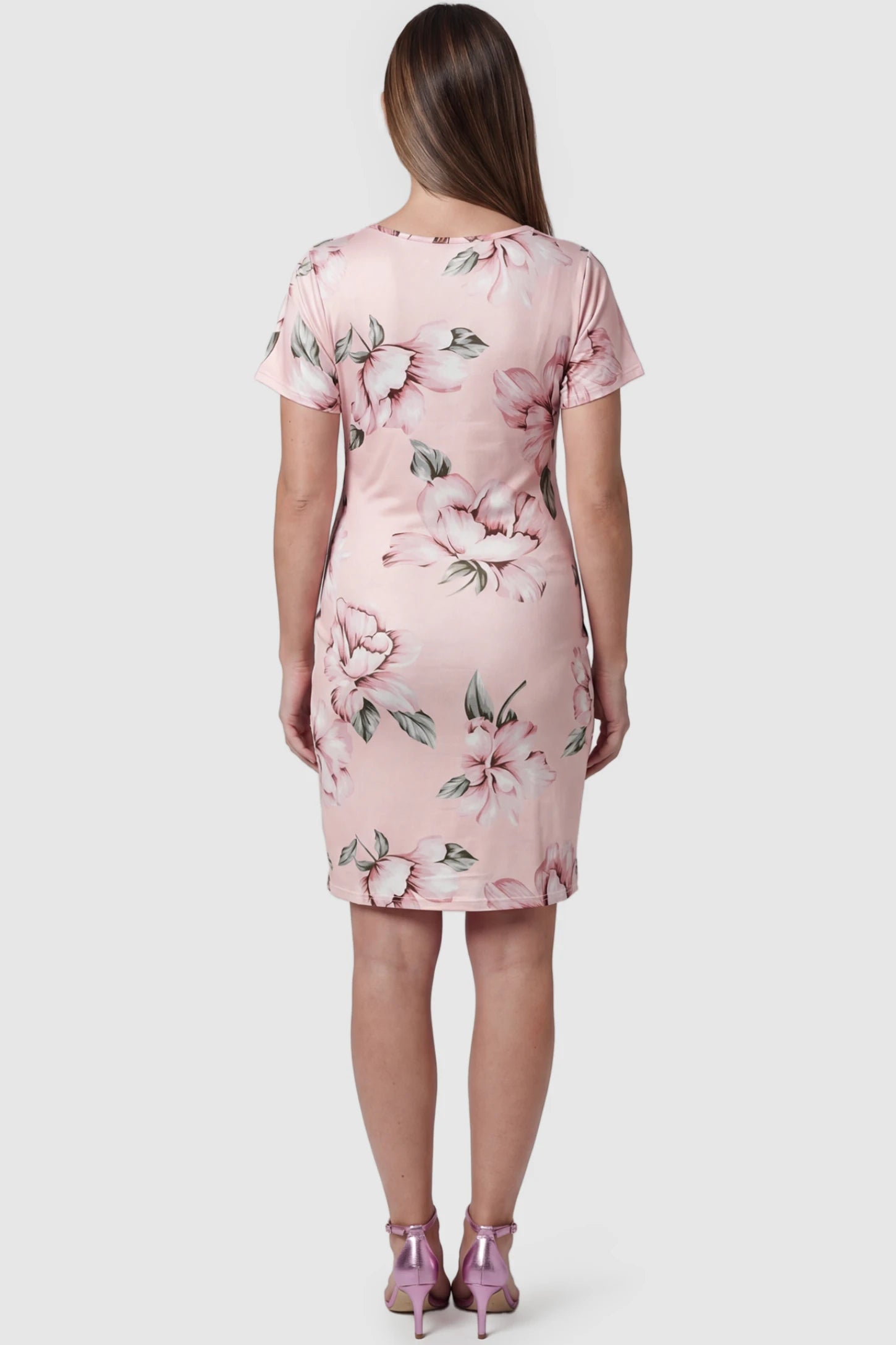 Floral Ruched Bodycon Maternity Short Dress Floral Ruched Bodycon Maternity Short Dress in pink floral featuring side ruching on pregnant model, back view.