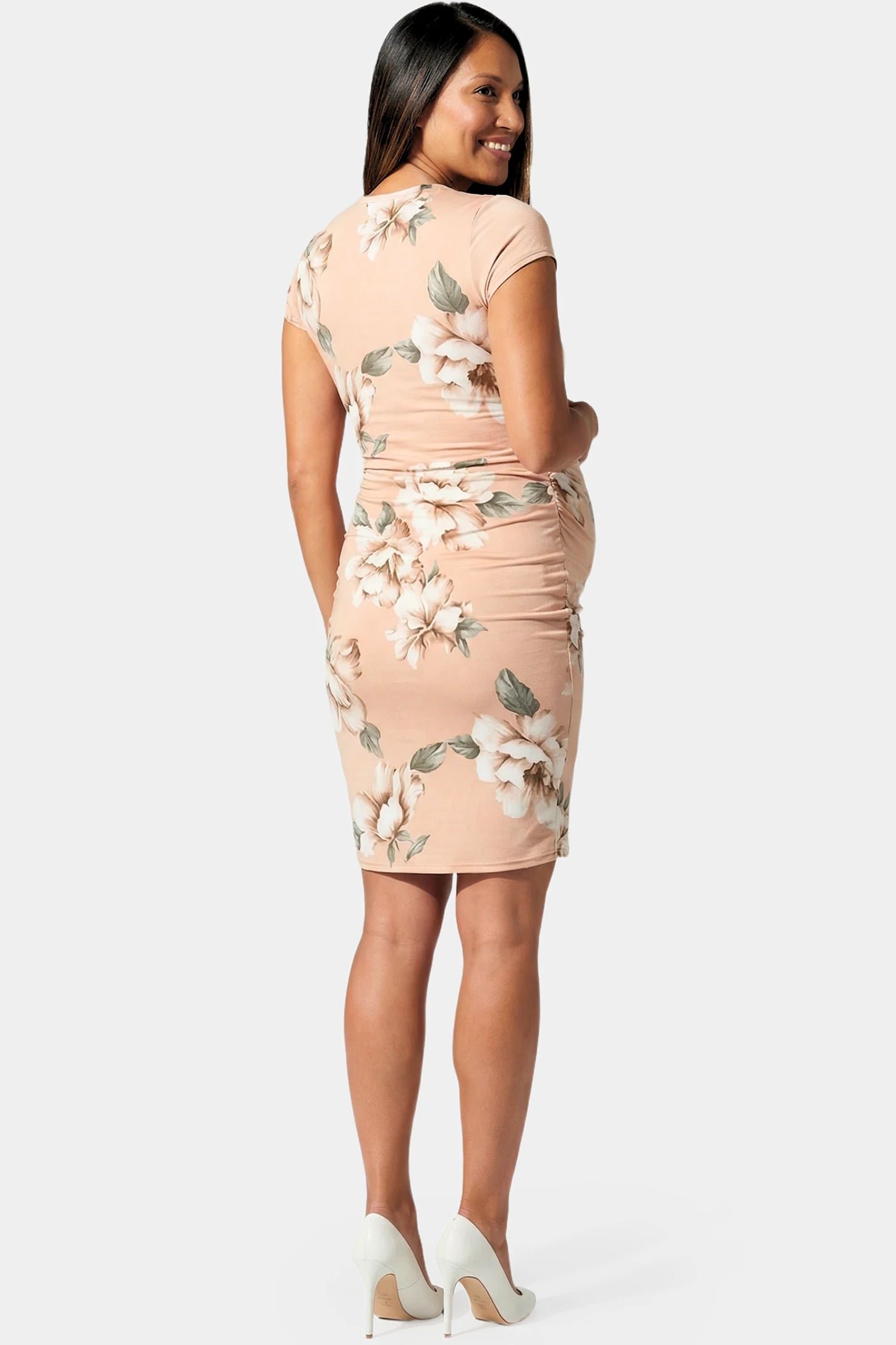 Floral Ruched Bodycon Maternity Short Dress Floral Ruched Bodycon Maternity Short Dress in pink floral featuring side ruching on pregnant model.