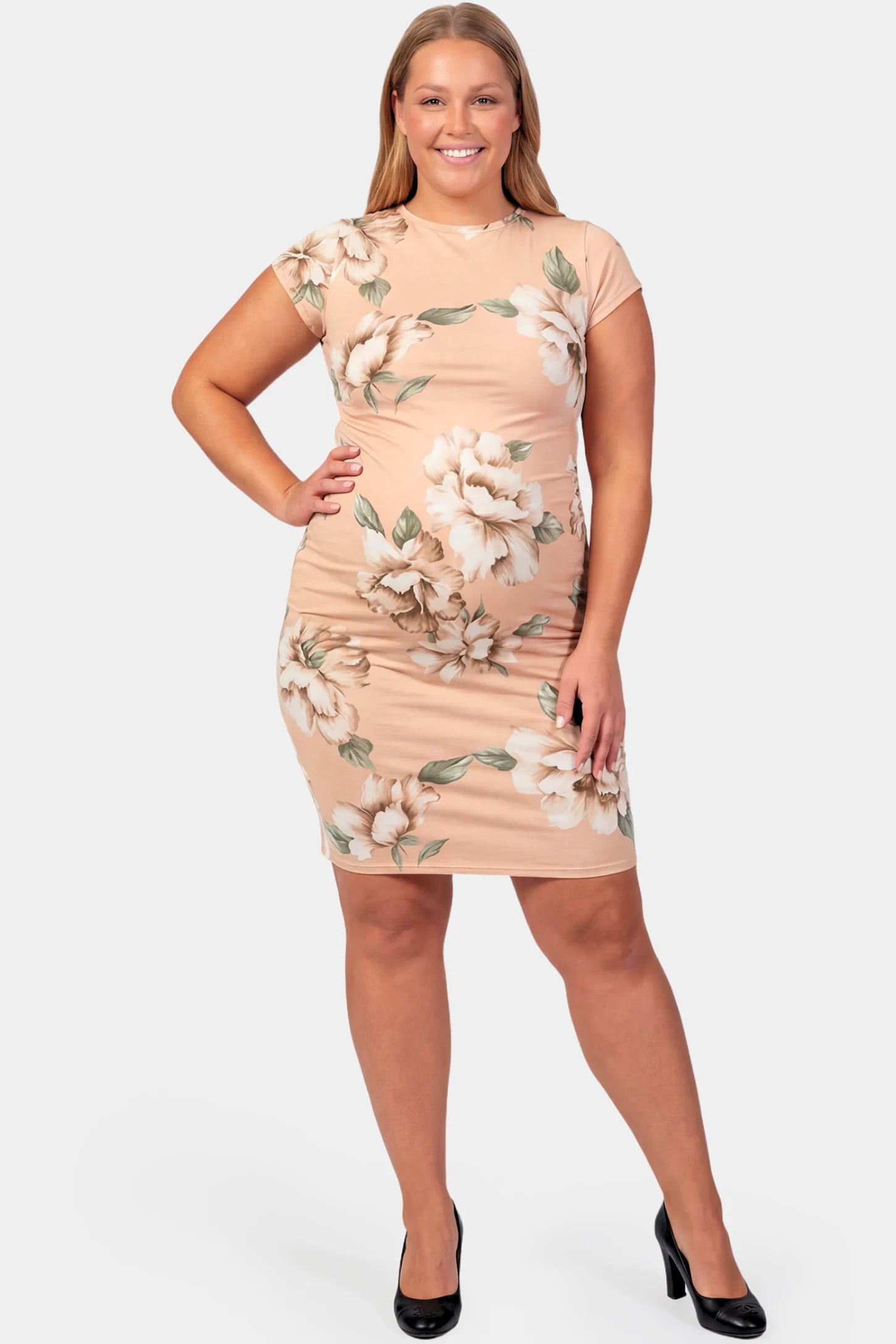 Floral Ruched Bodycon Maternity Short Dress Floral Ruched Bodycon Maternity Short Dress in pink floral featuring side ruching on a plus size pregnant model.