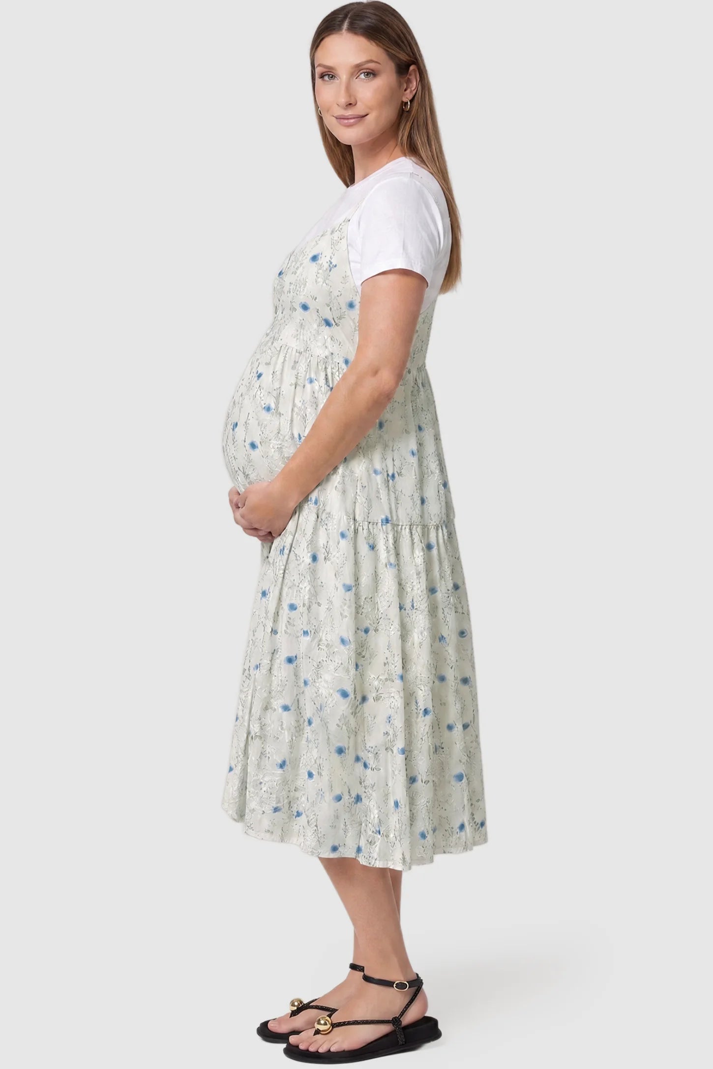 Floral Print Round Neck Layered Skirt Maternity Midi Dress Floral print round neck layered skirt maternity midi dress in blue with elegant layered floral design, side view on pregnant model