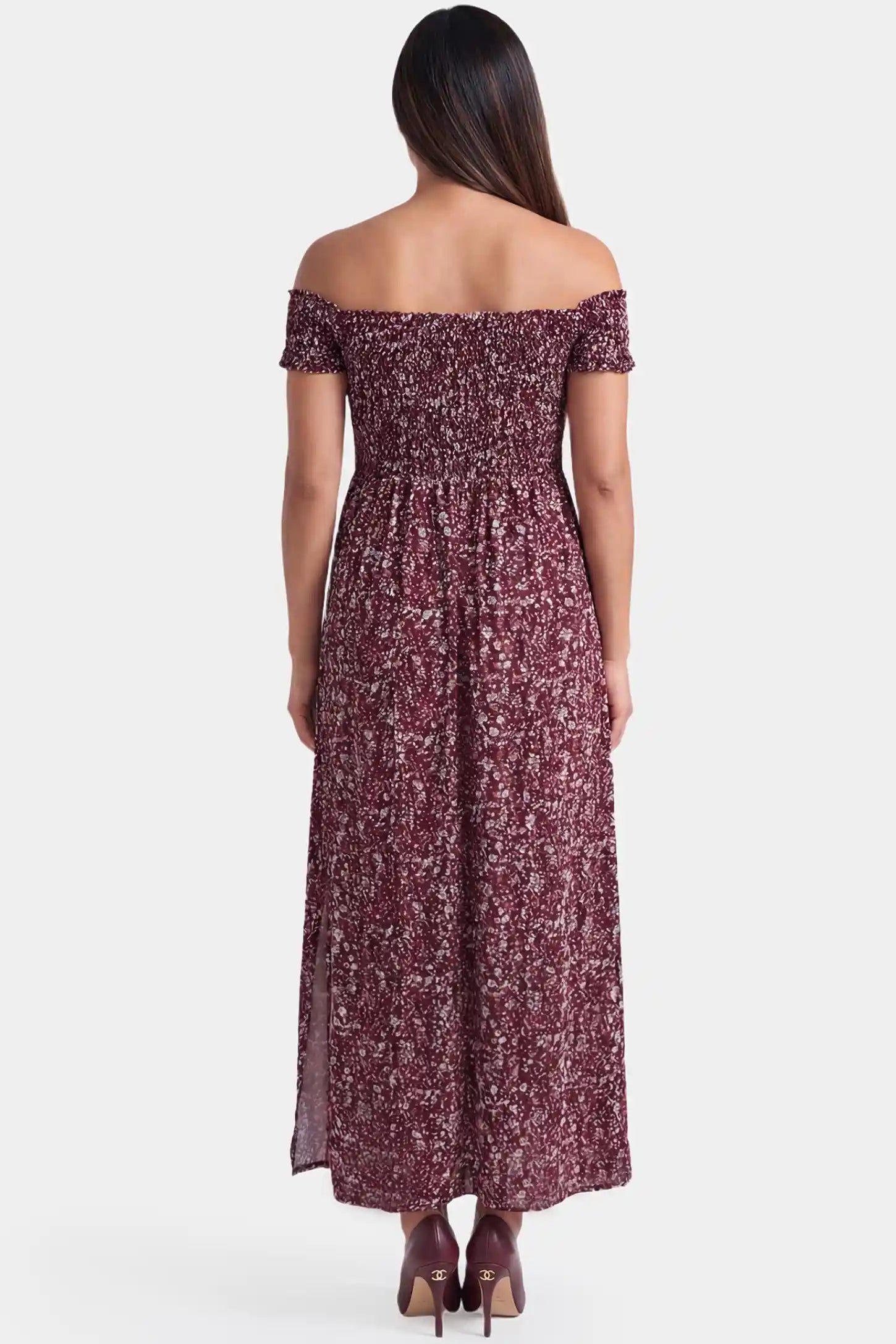 Floral Off-Shoulder Smocked Bodice Maxi Maternity Dress Floral off-shoulder smocked bodice maxi maternity dress in burgundy featuring elastic smocked back in back view on a pregnant model