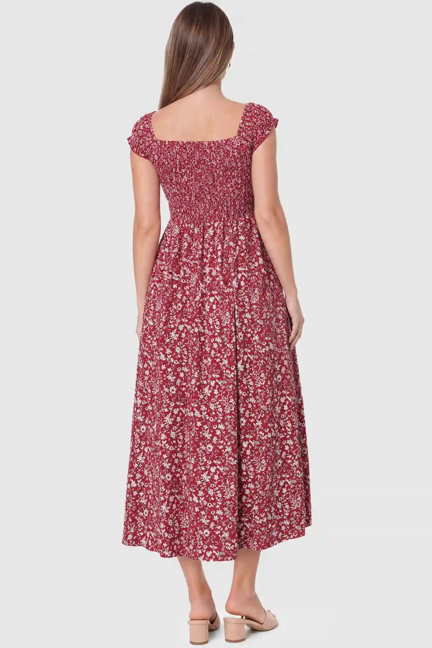 Floral Off-Shoulder Smocked Bodice Maxi Maternity Dress Floral off-shoulder smocked bodice maxi maternity dress in burgundy featuring elastic smocked back in back view on a pregnant model