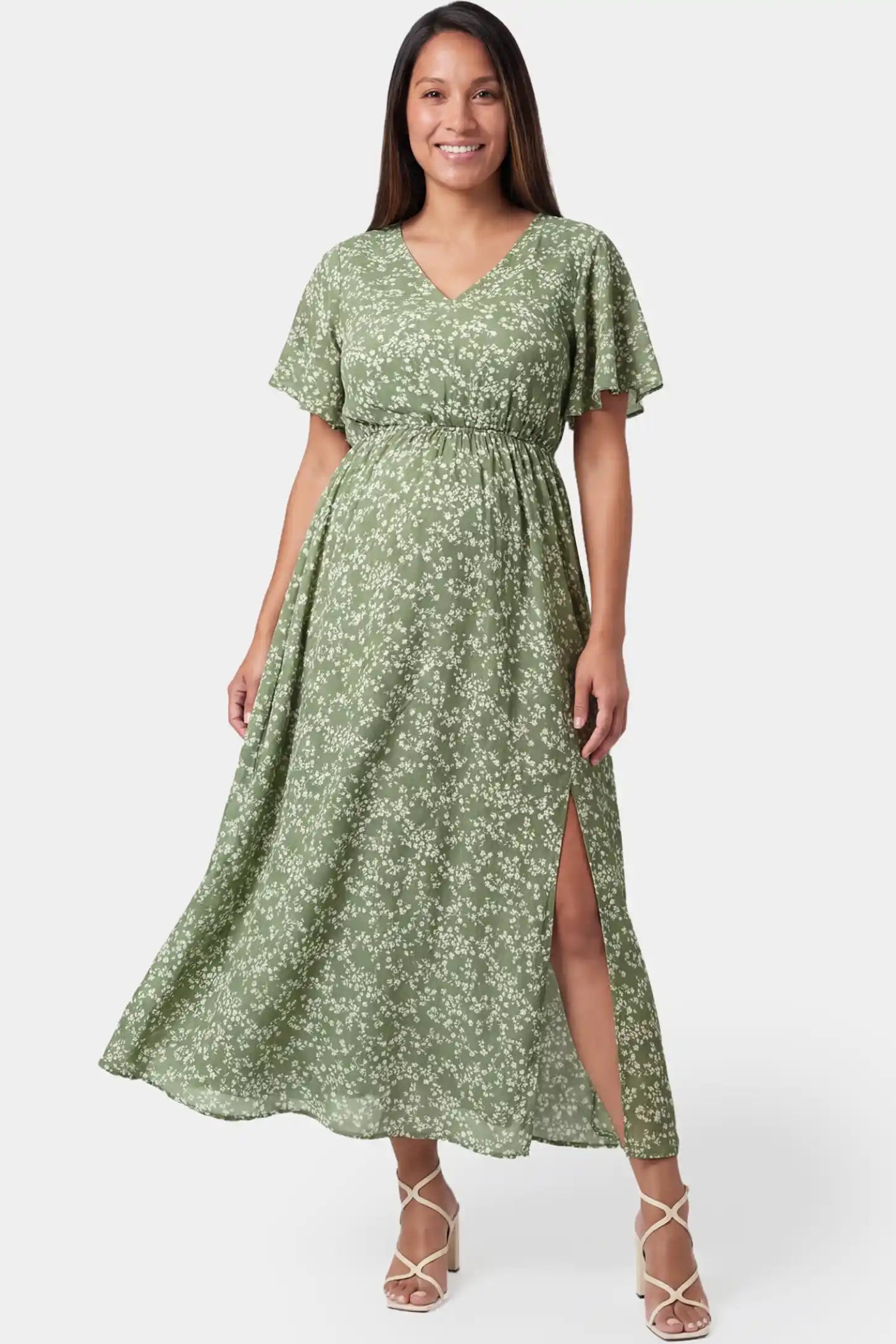 Floral V-neck short sleeve waist-cinching maxi maternity dress in light green featuring romantic floral print in front view on a pregnant model