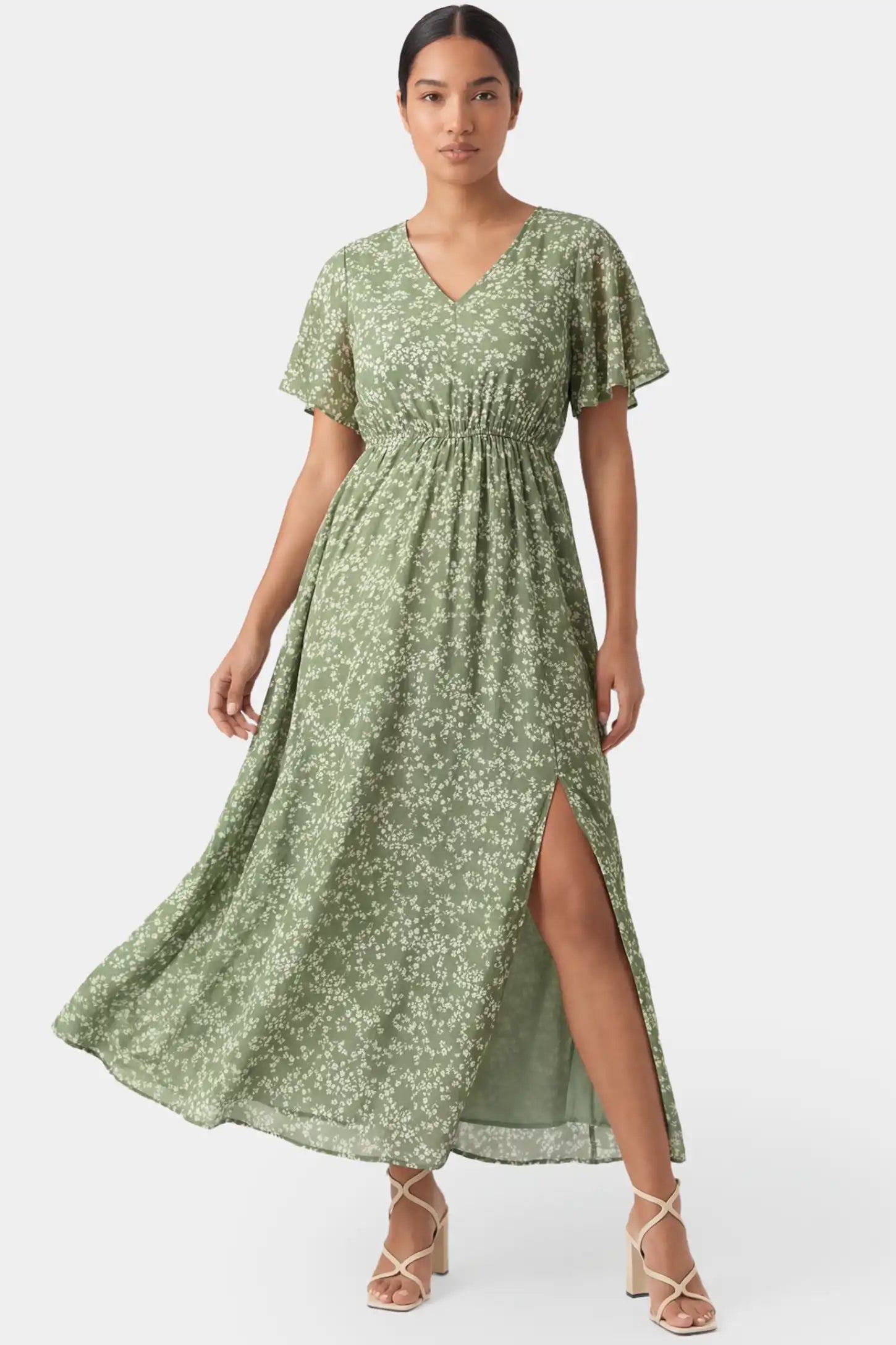 Floral V-Neck Short Sleeve Waist-Cinching Maxi Maternity Dress Floral V-neck short sleeve waist-cinching maxi maternity dress in light green featuring romantic floral print in front view on a postpartum model