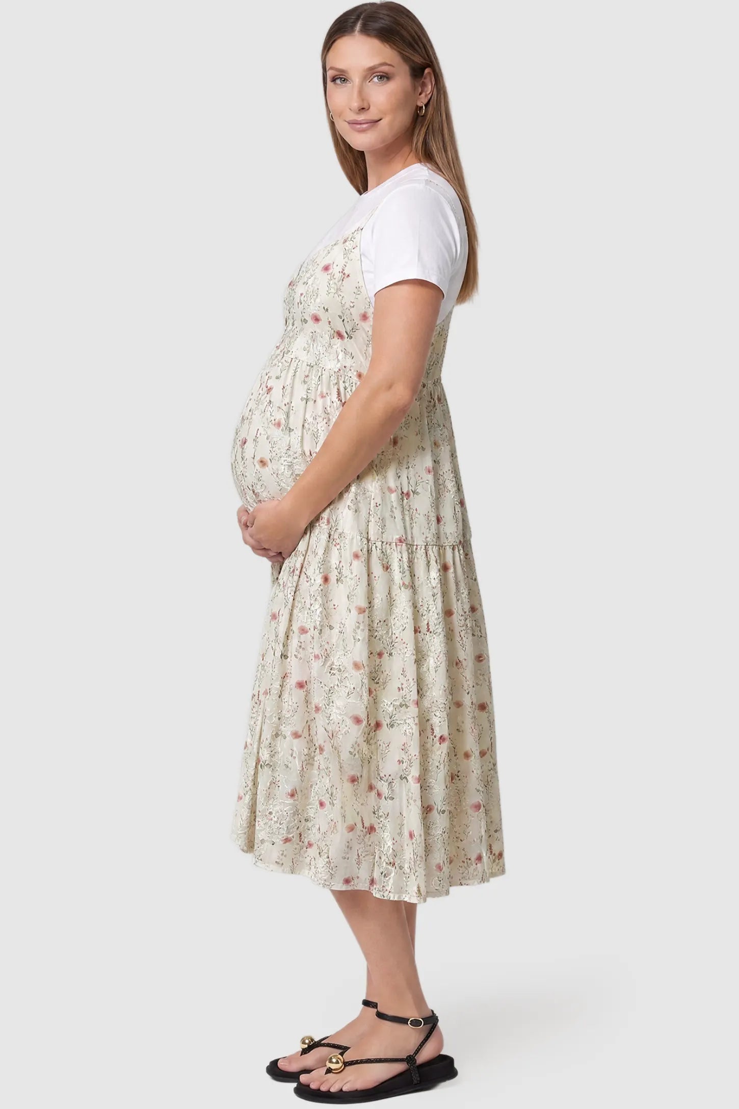Floral Print Round Neck Layered Skirt Maternity Midi Dress Floral print round neck layered skirt maternity midi dress in pink with elegant layered floral design, side view on pregnant model