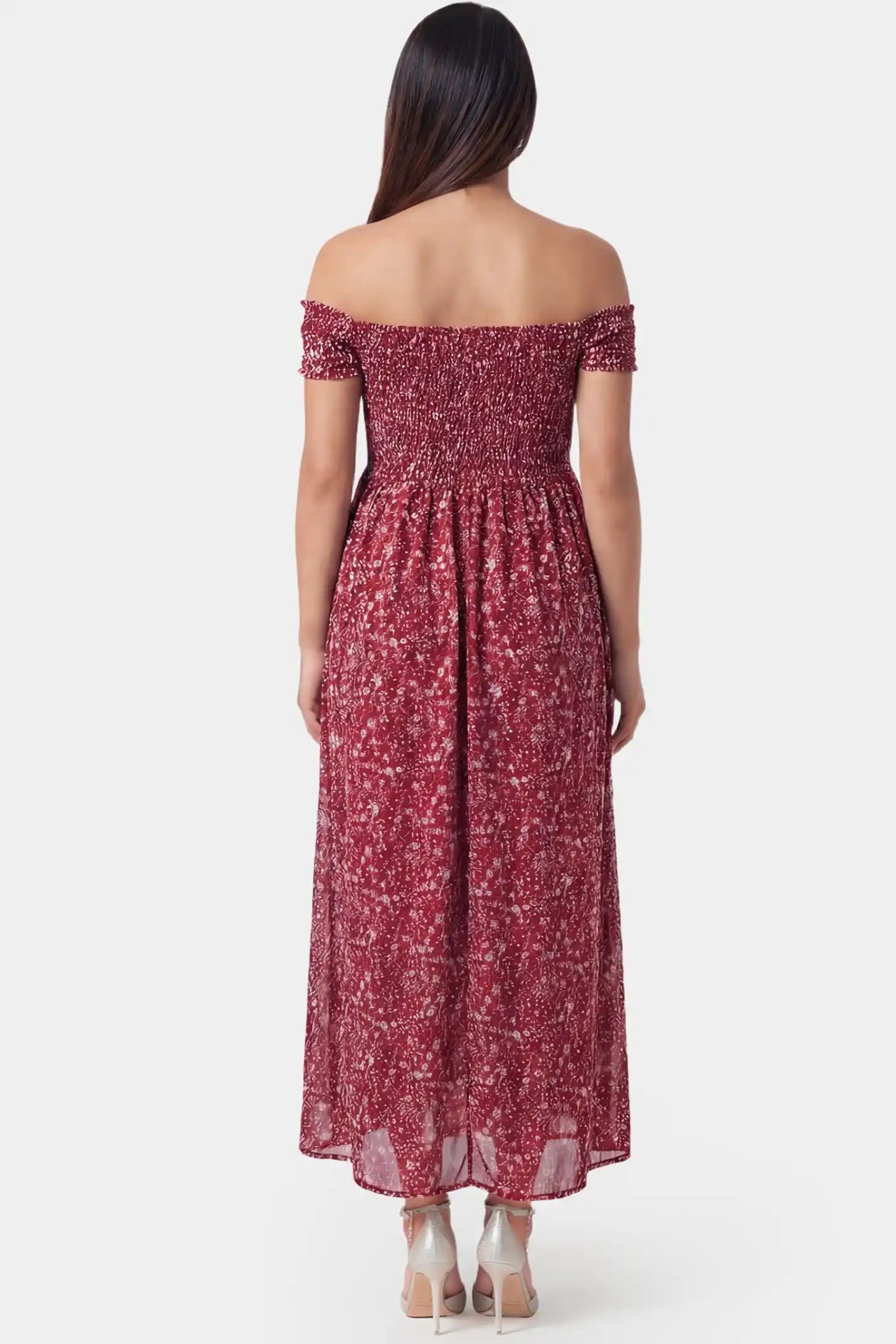 Floral Off-Shoulder Smocked Bodice Maxi Maternity Dress Floral off-shoulder smocked bodice maxi maternity dress in red featuring elastic smocked back in back view on a pregnant model